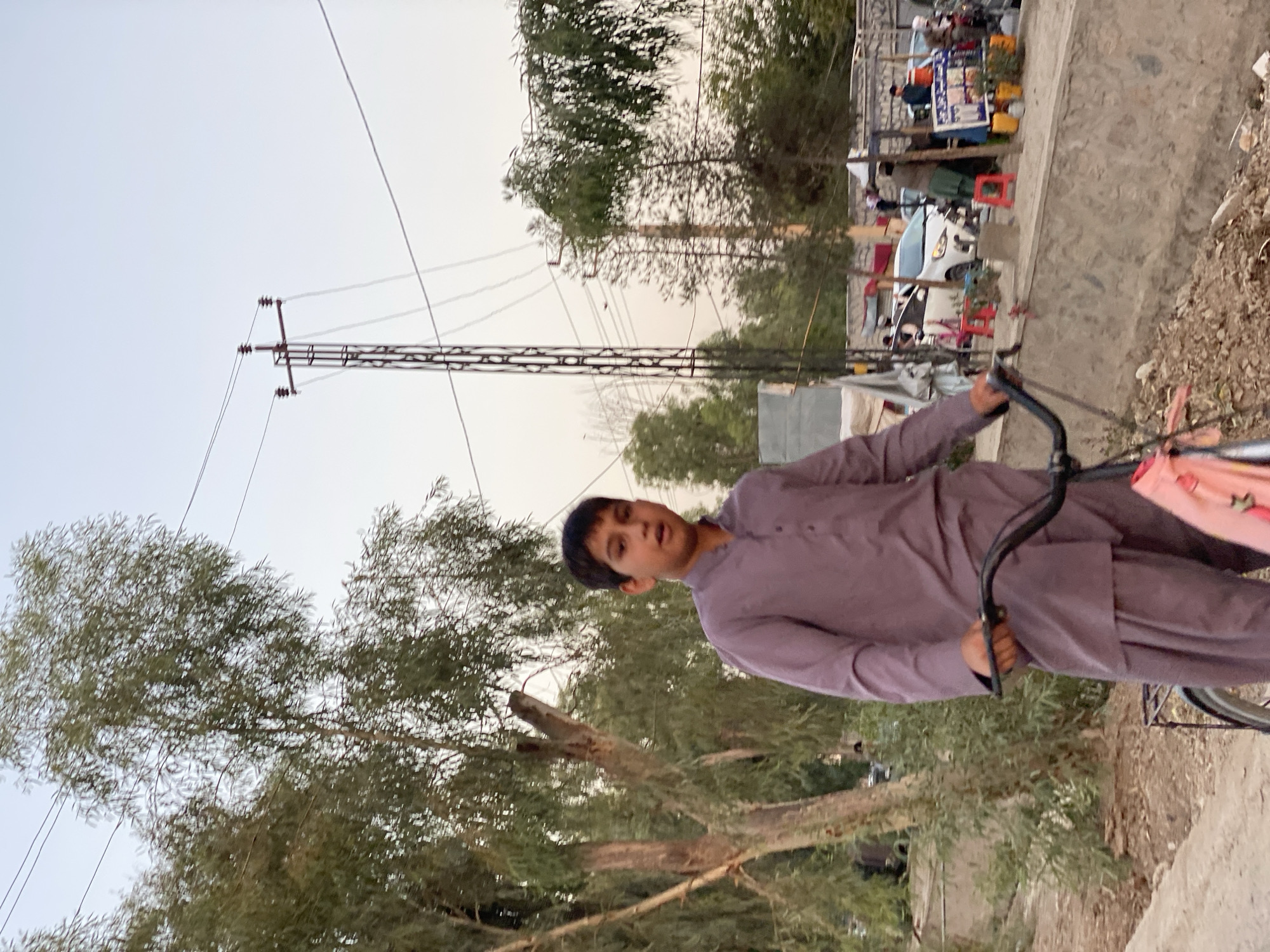 Street life on a Kandahar dirt road, mid-afternoon.