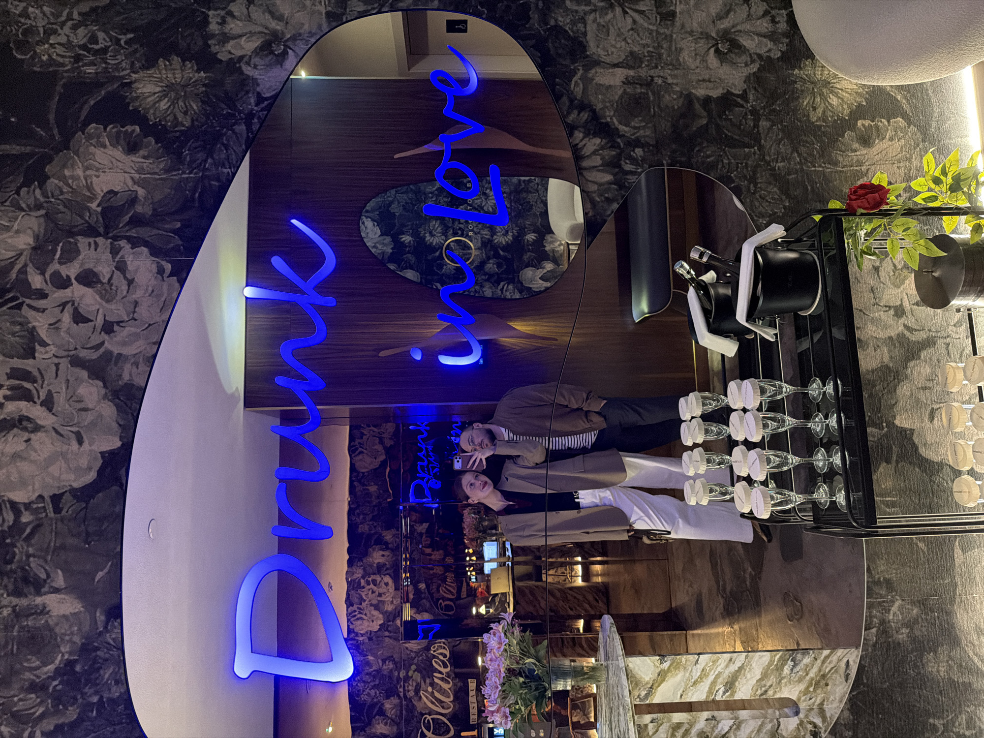 Selfie moment captured at neon-lit venue in Tbilisi