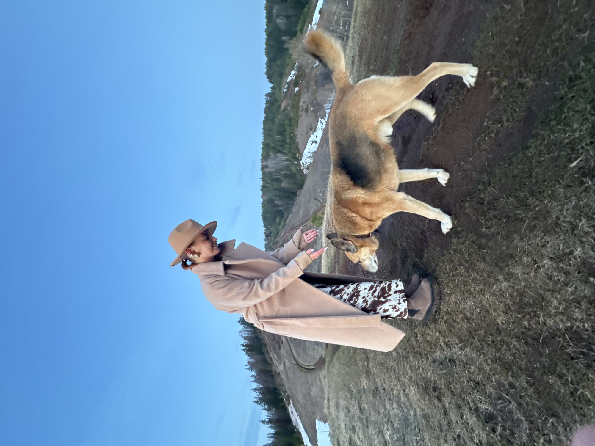 Woman with dog spotted on rural slope near Ольховка