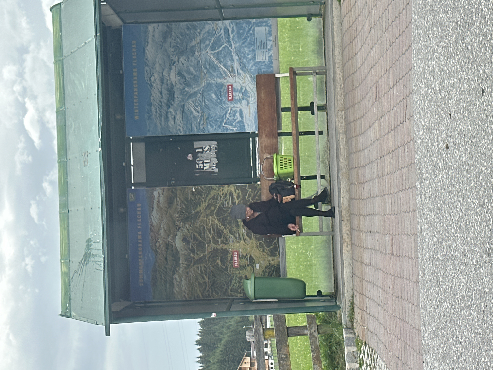 Bus stop and countryside glimpses in overcast Flachau