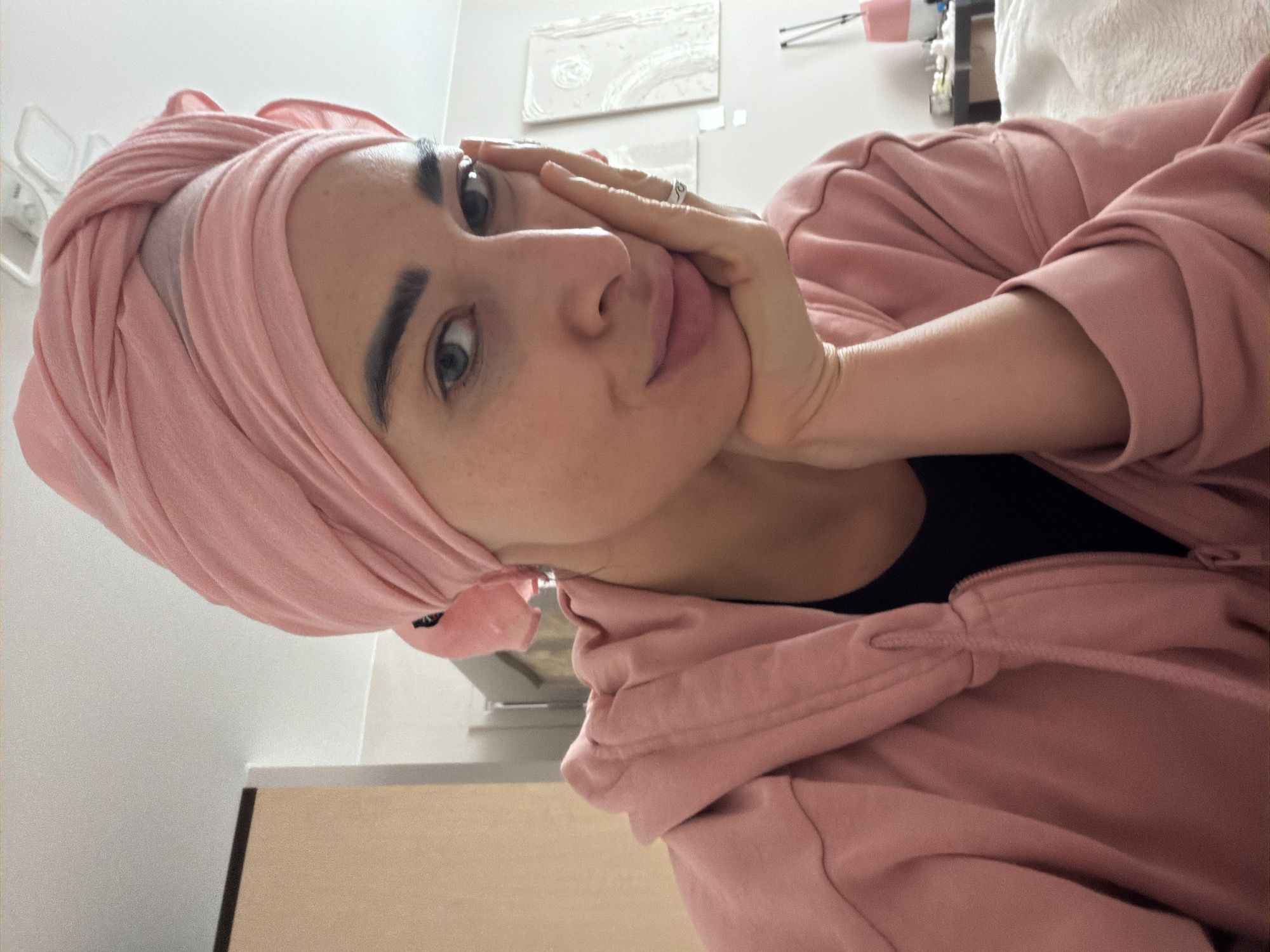 Woman in pink Nike hoodie photographed indoors Saint Petersburg