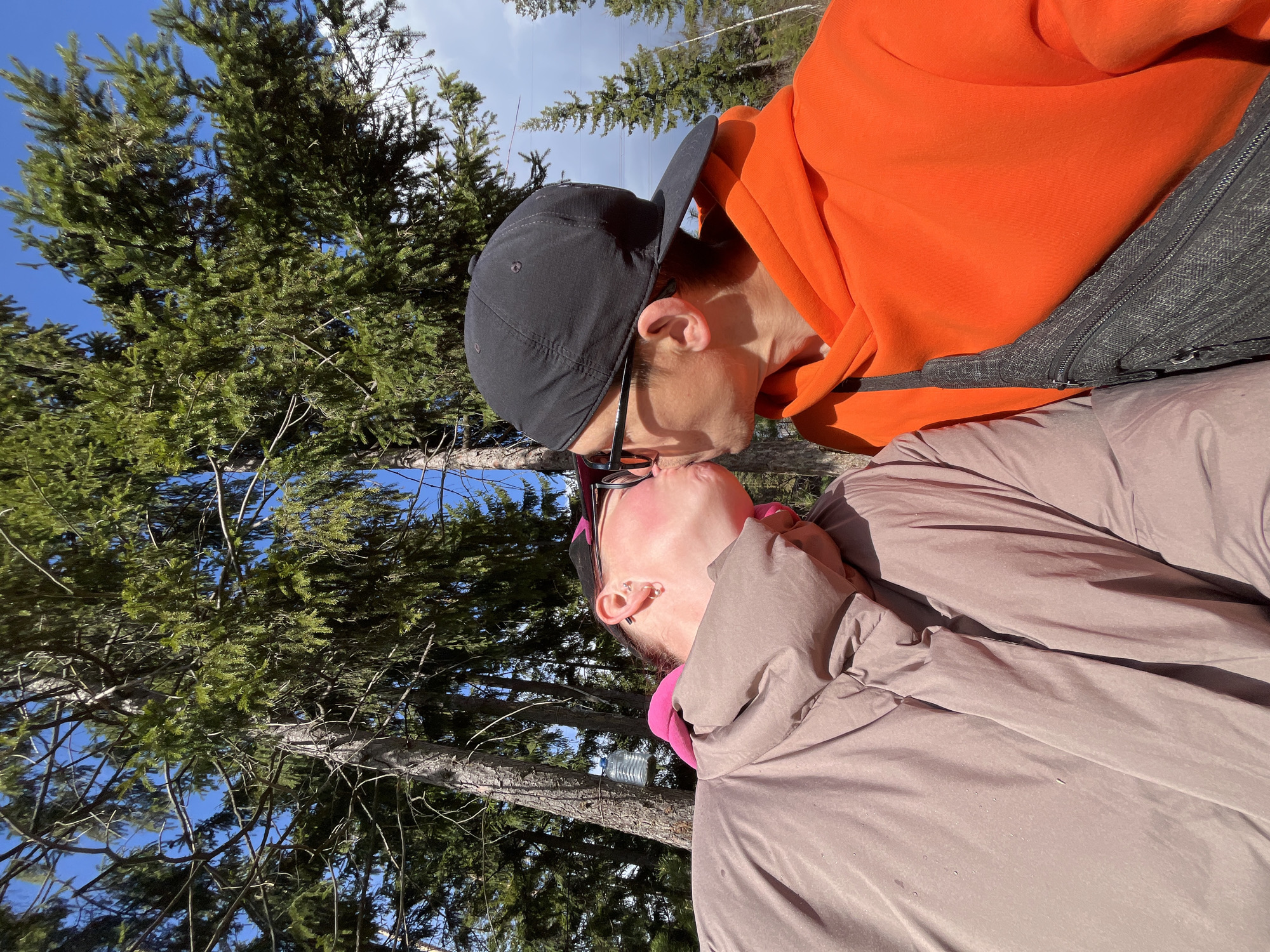 Couple shares intimate moment in Chaikovsky pine forest