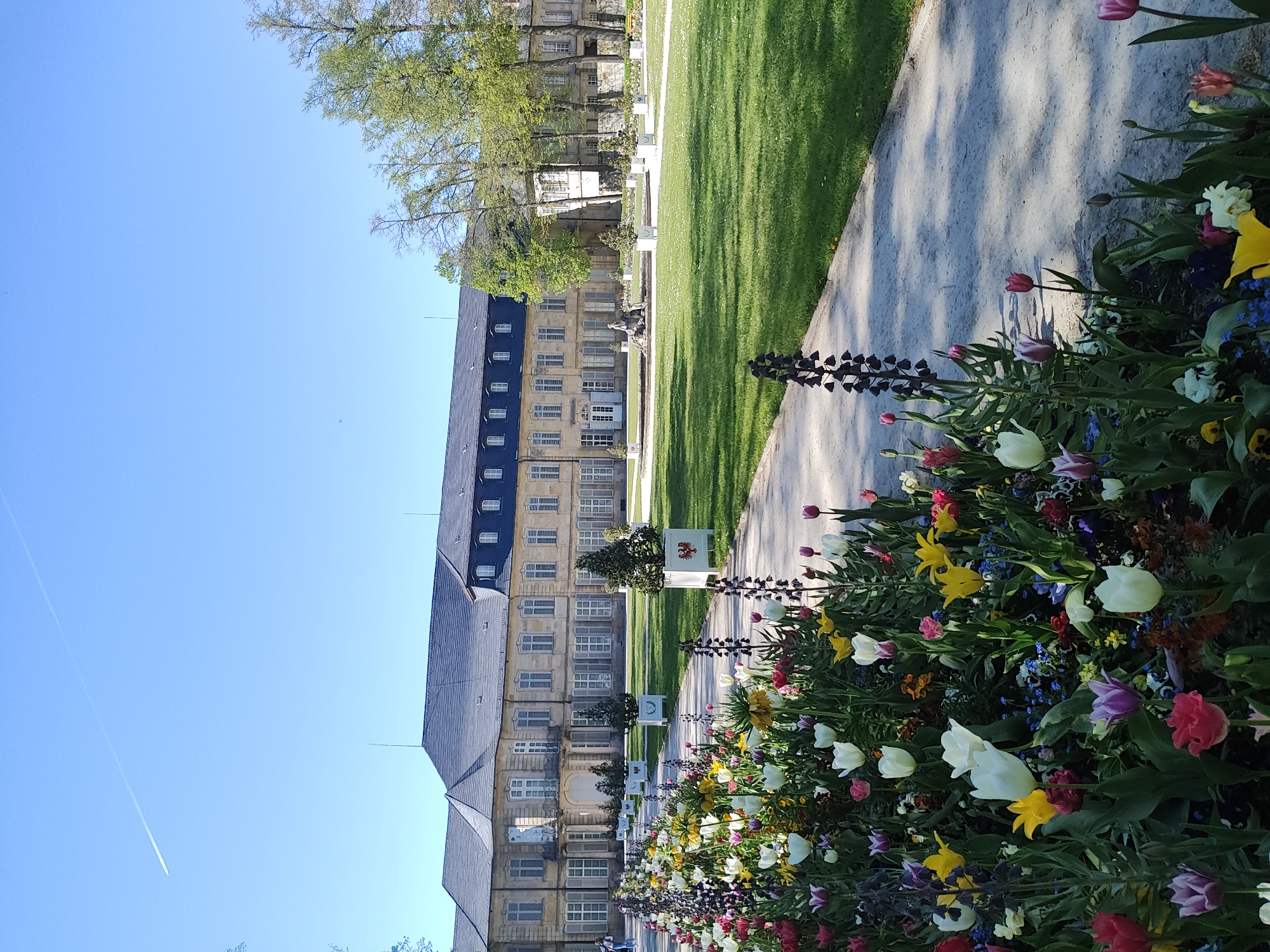 Spring day visitors enjoy Hofgarten palace gardens in Bayreuth