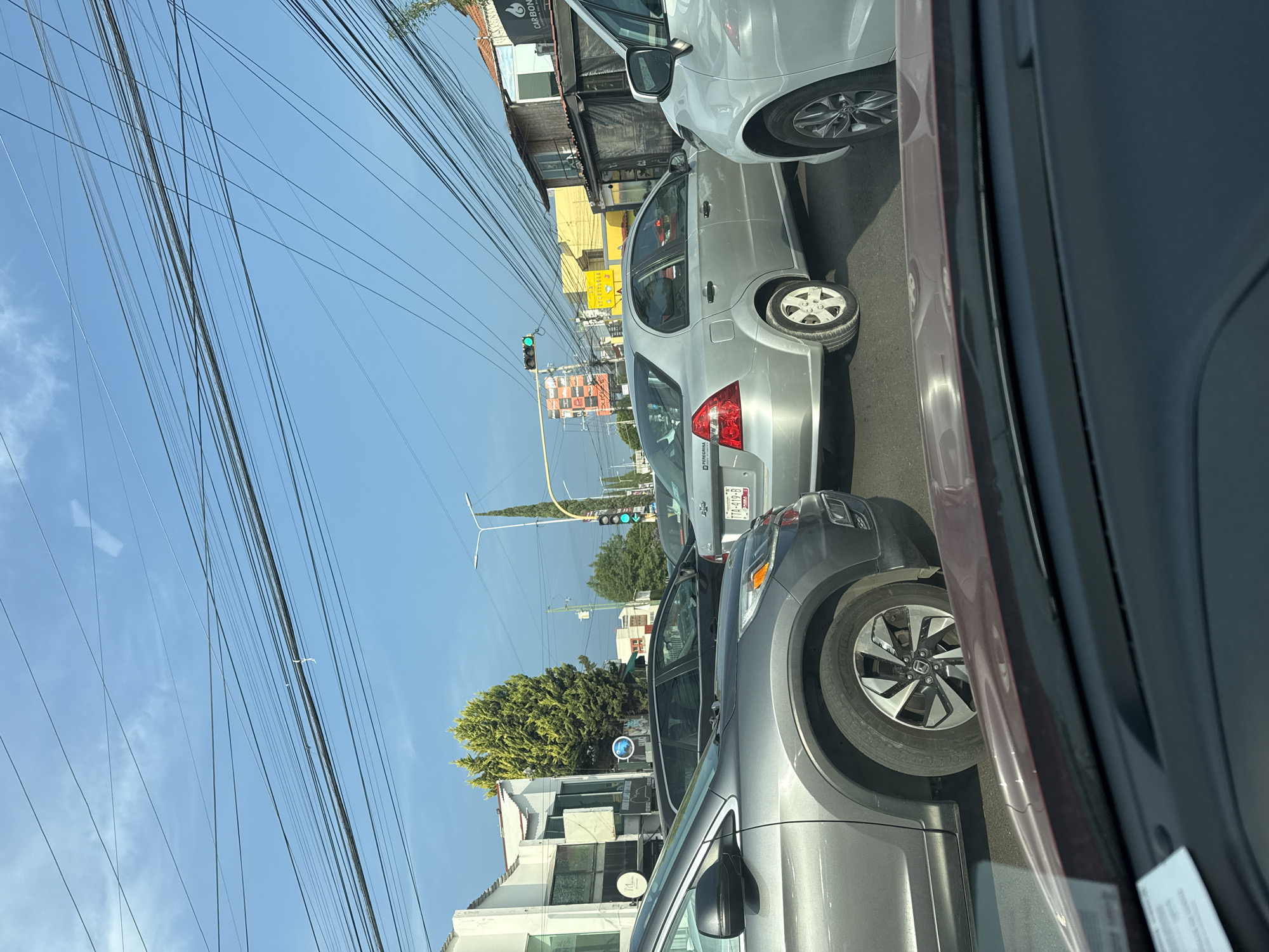 Street scene photographed from vehicle in Puebla, Mexico