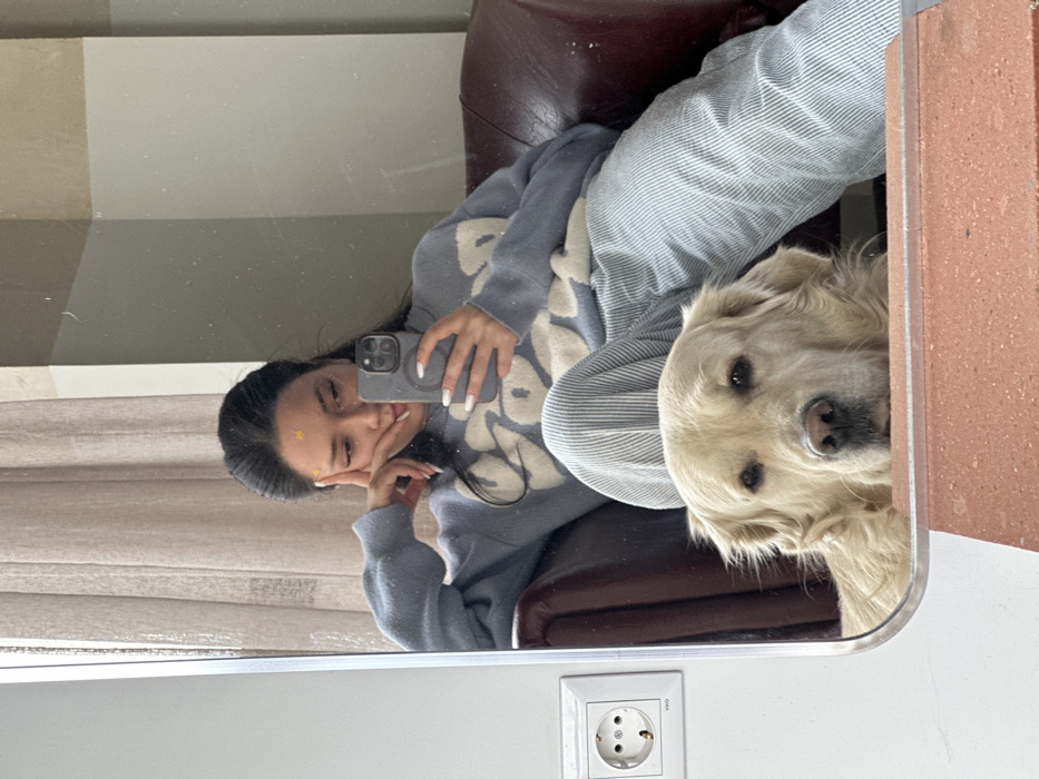 Woman, golden retriever share quiet morning in Yerevan, Armenia