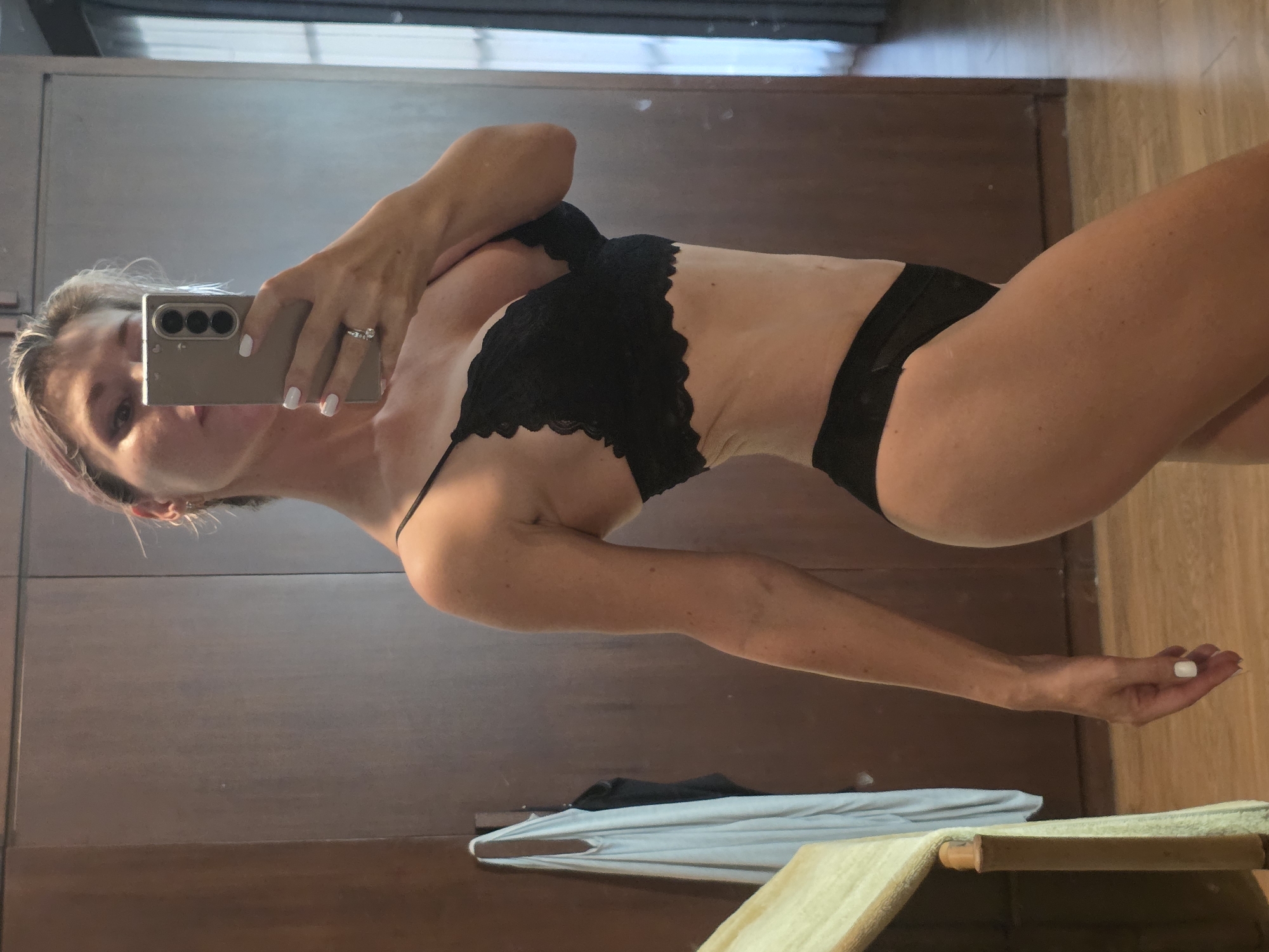 Lingerie mirror selfie session in North Kuta bedroom