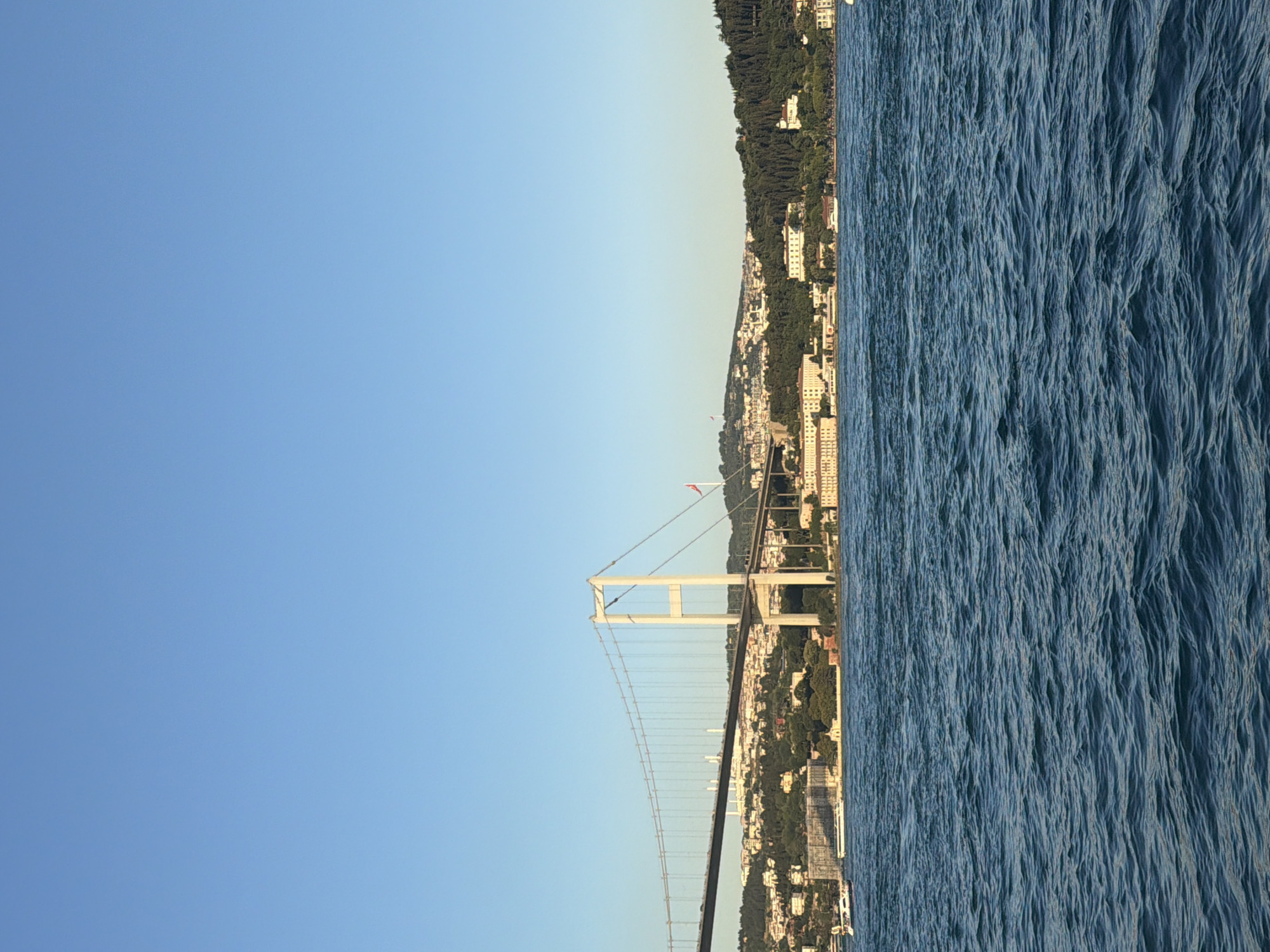 Bosphorus waterfront view with mosque and Fatih Sultan Mehmet Bridge