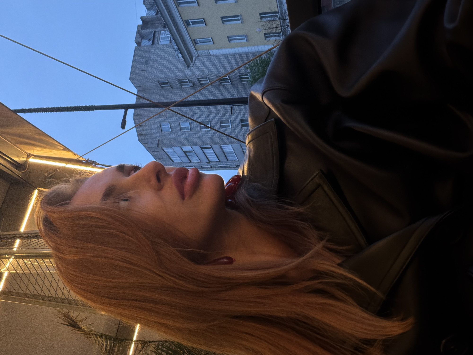 Auburn-haired woman spotted multiple times in rainy Krasnoyarsk evening