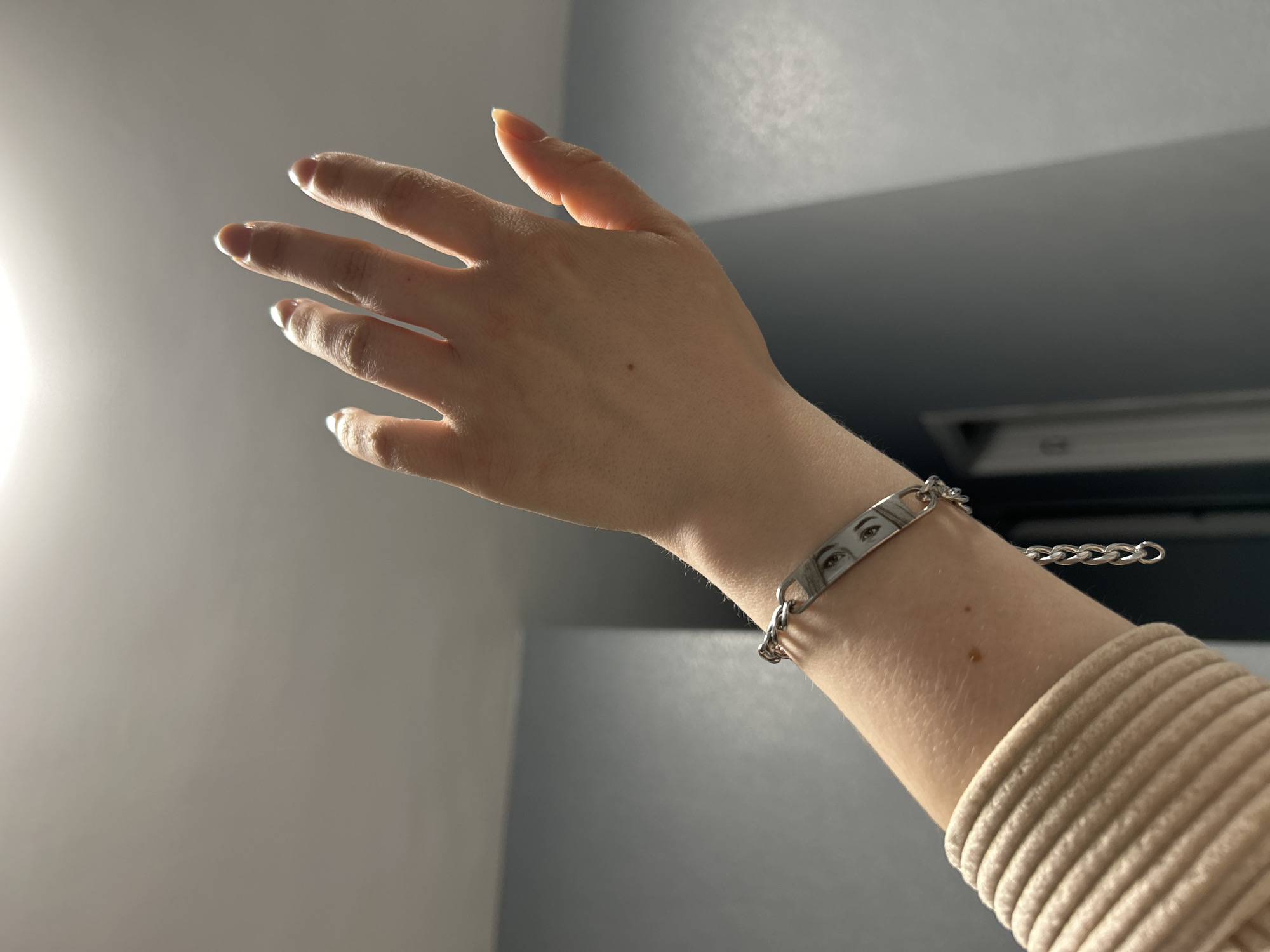 Person displays hand jewelry and nail art in Saint Petersburg