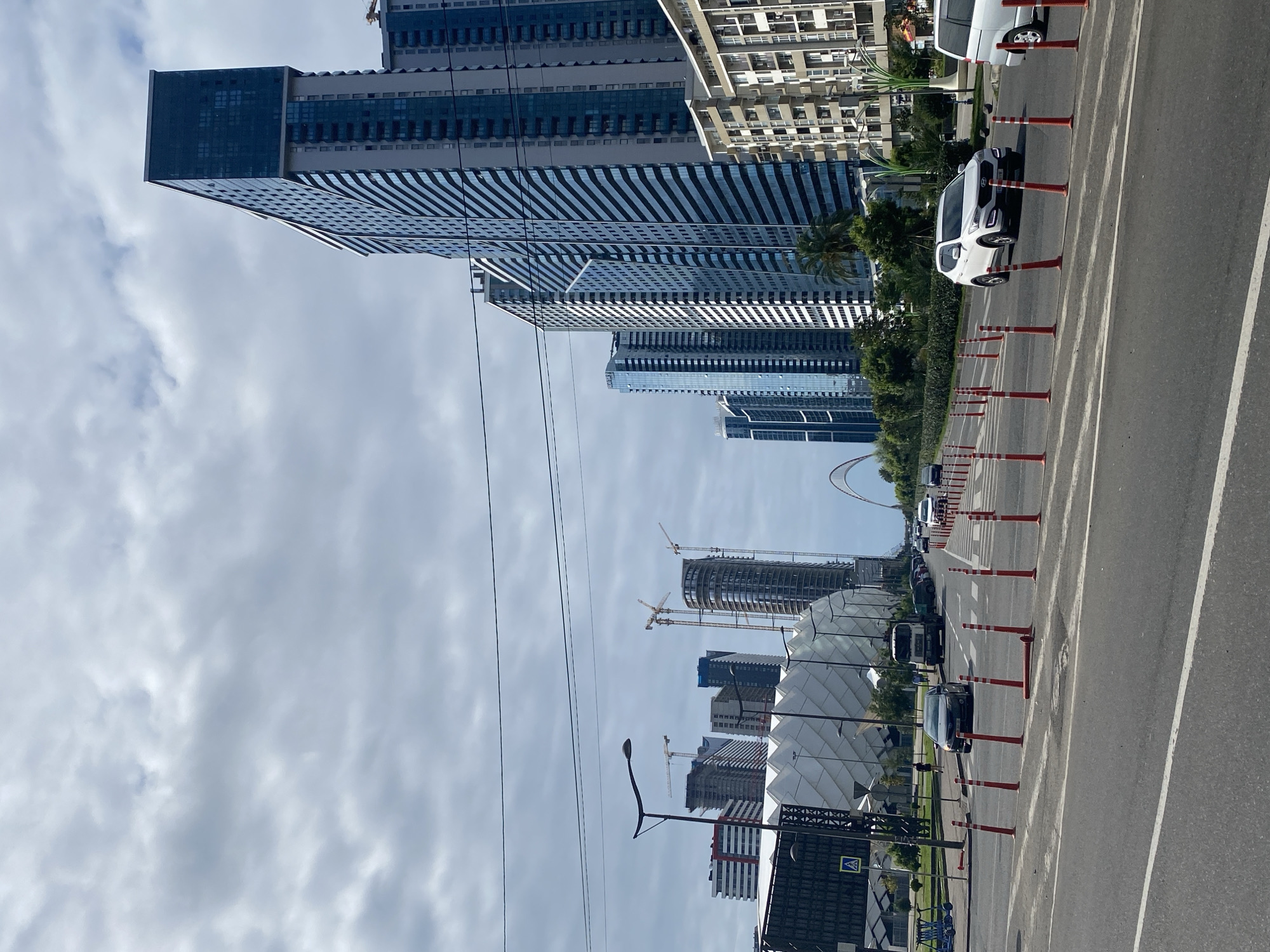 Batumi's modern streetscape mid-construction on a overcast afternoon