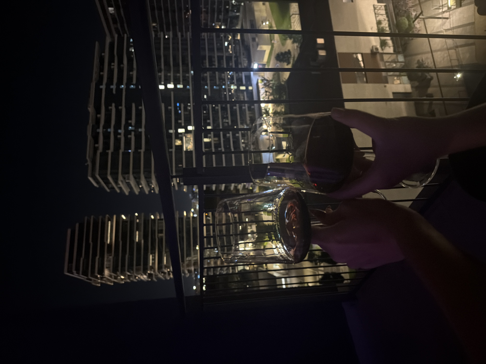 Late-night wine toast on a Belgrade balcony