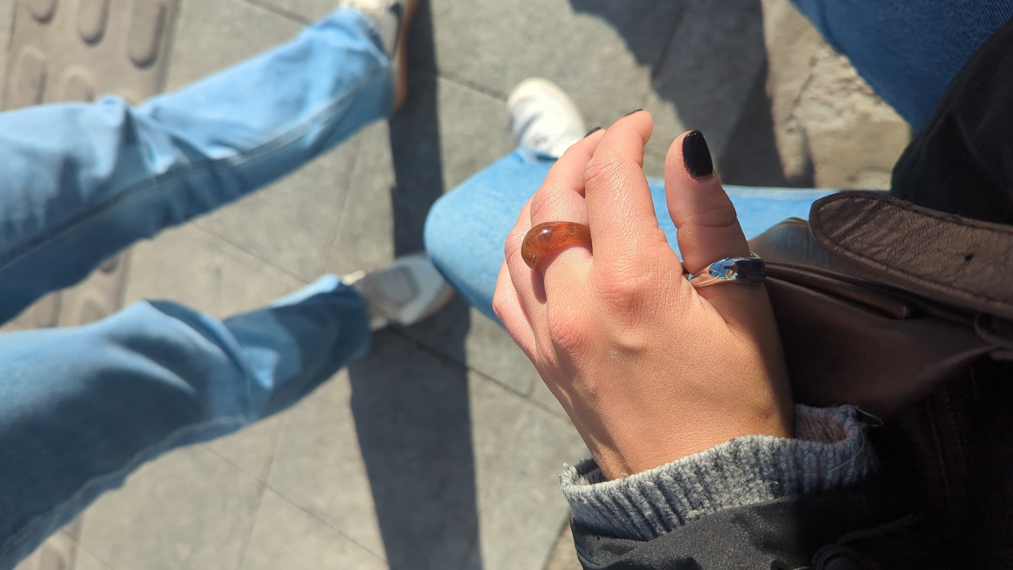 Two people sitting casually in Dublin street area