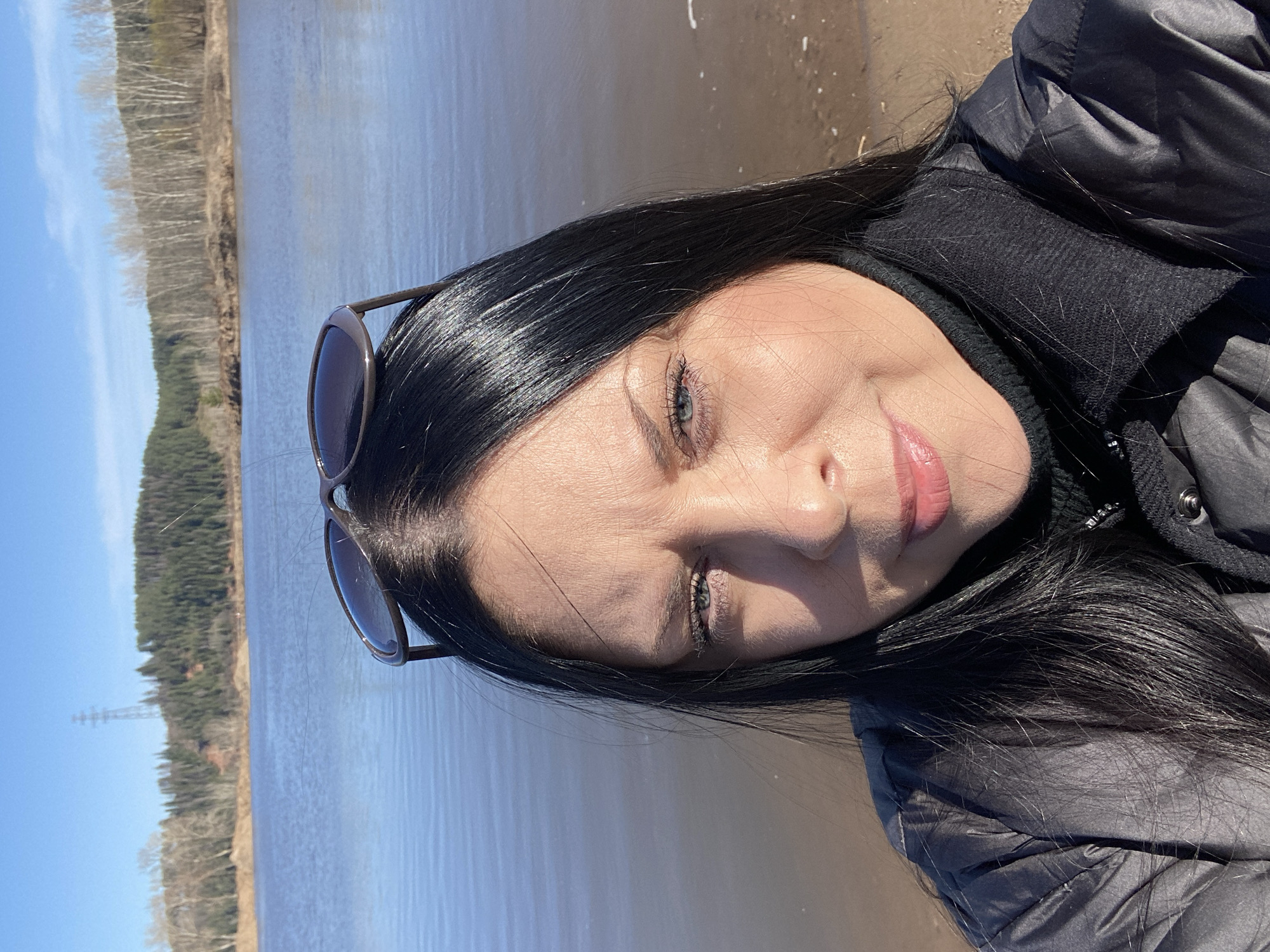 Woman photographed during waterfront outing in Noviy, Russia