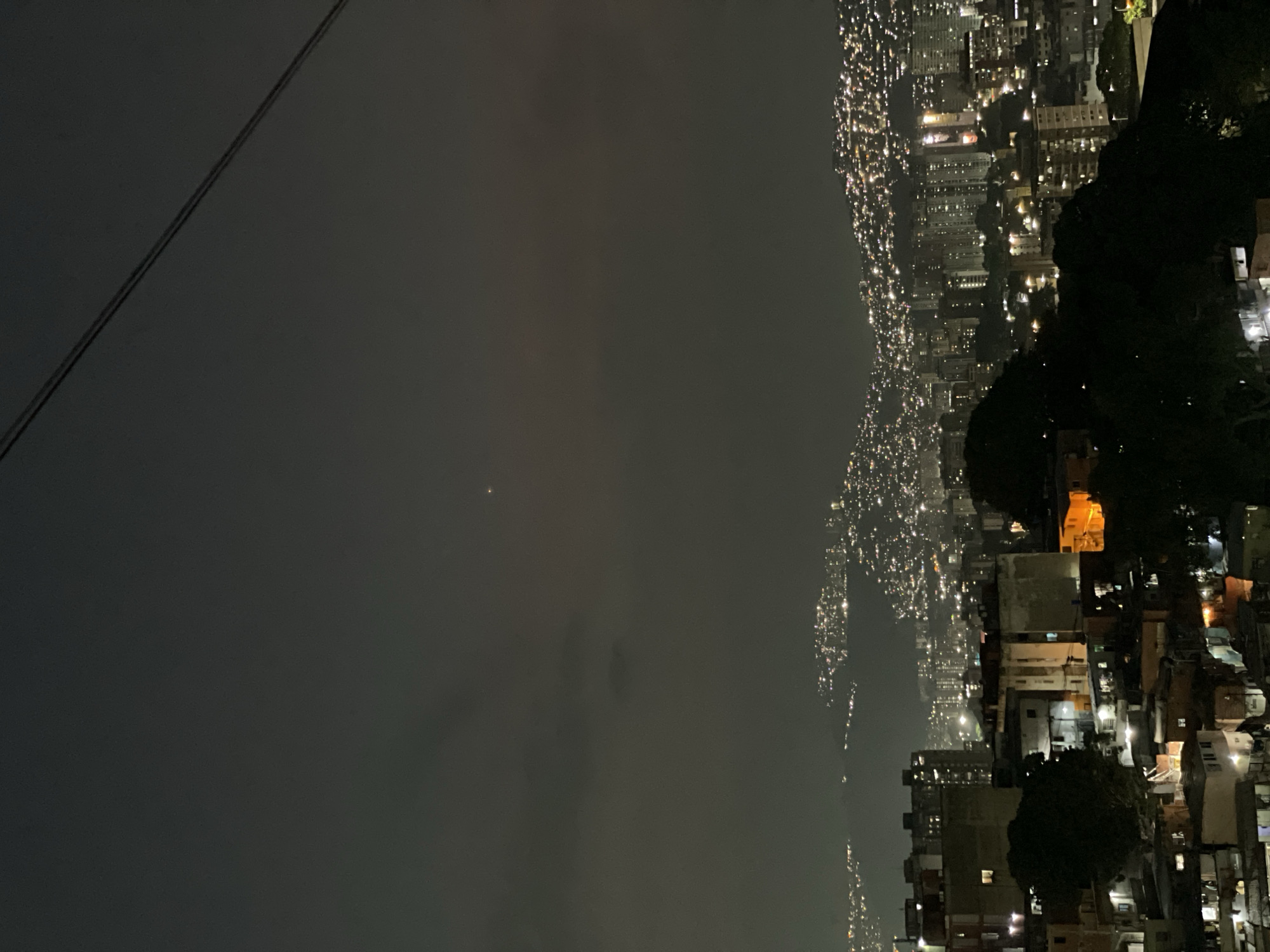 Aerial night view captures divided urban landscape in Caracas