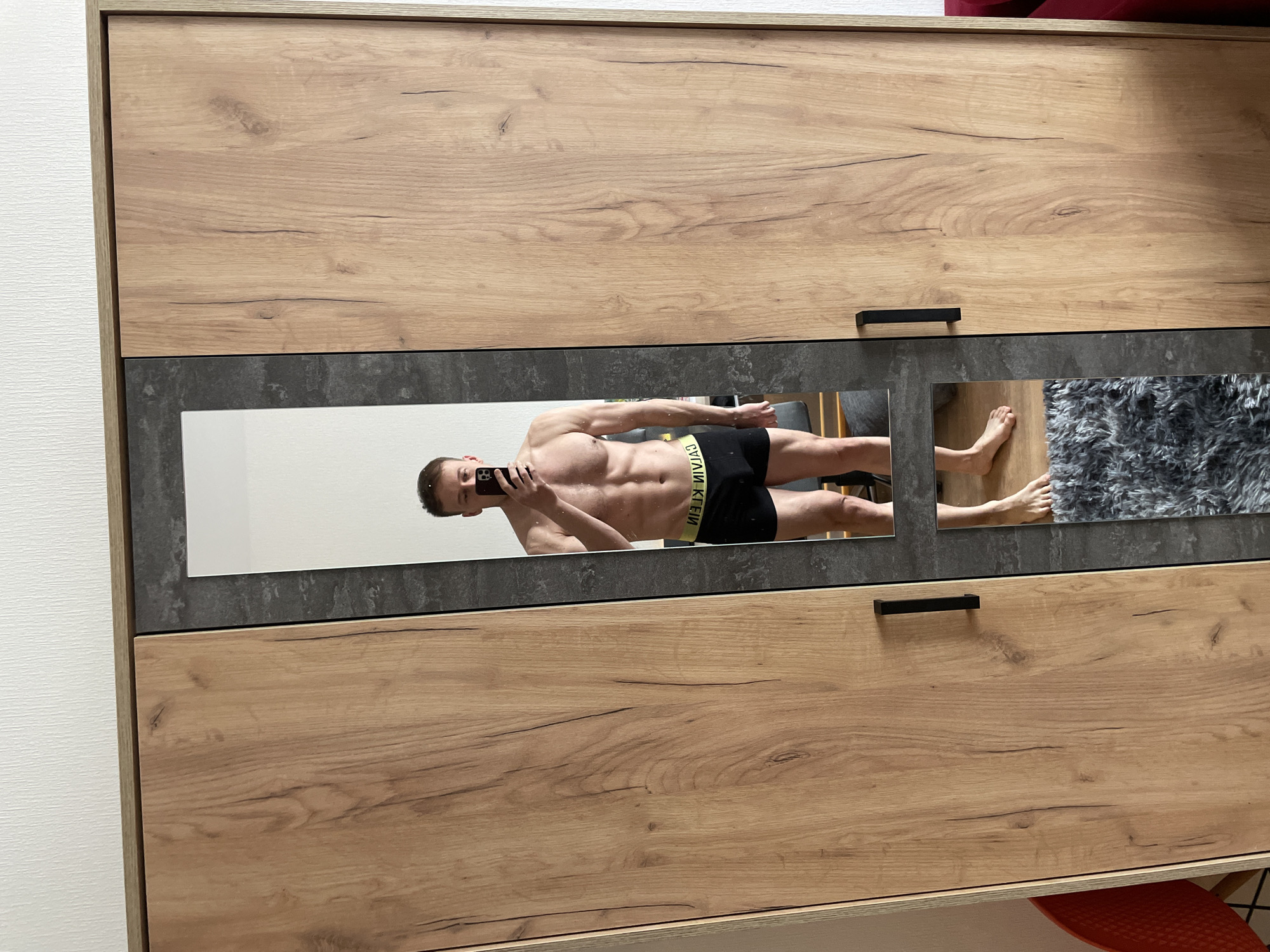 Man takes mirror selfies at home in Sinyavino, Russia