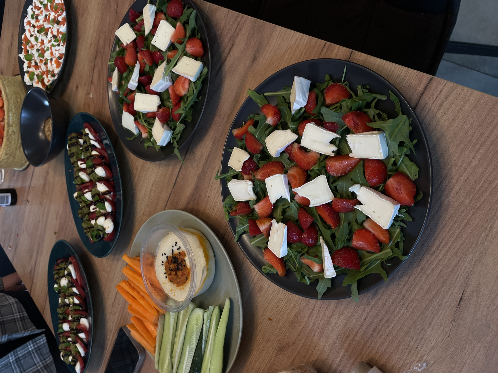 Outdoor dining experience with appetizers and ceramic art documented