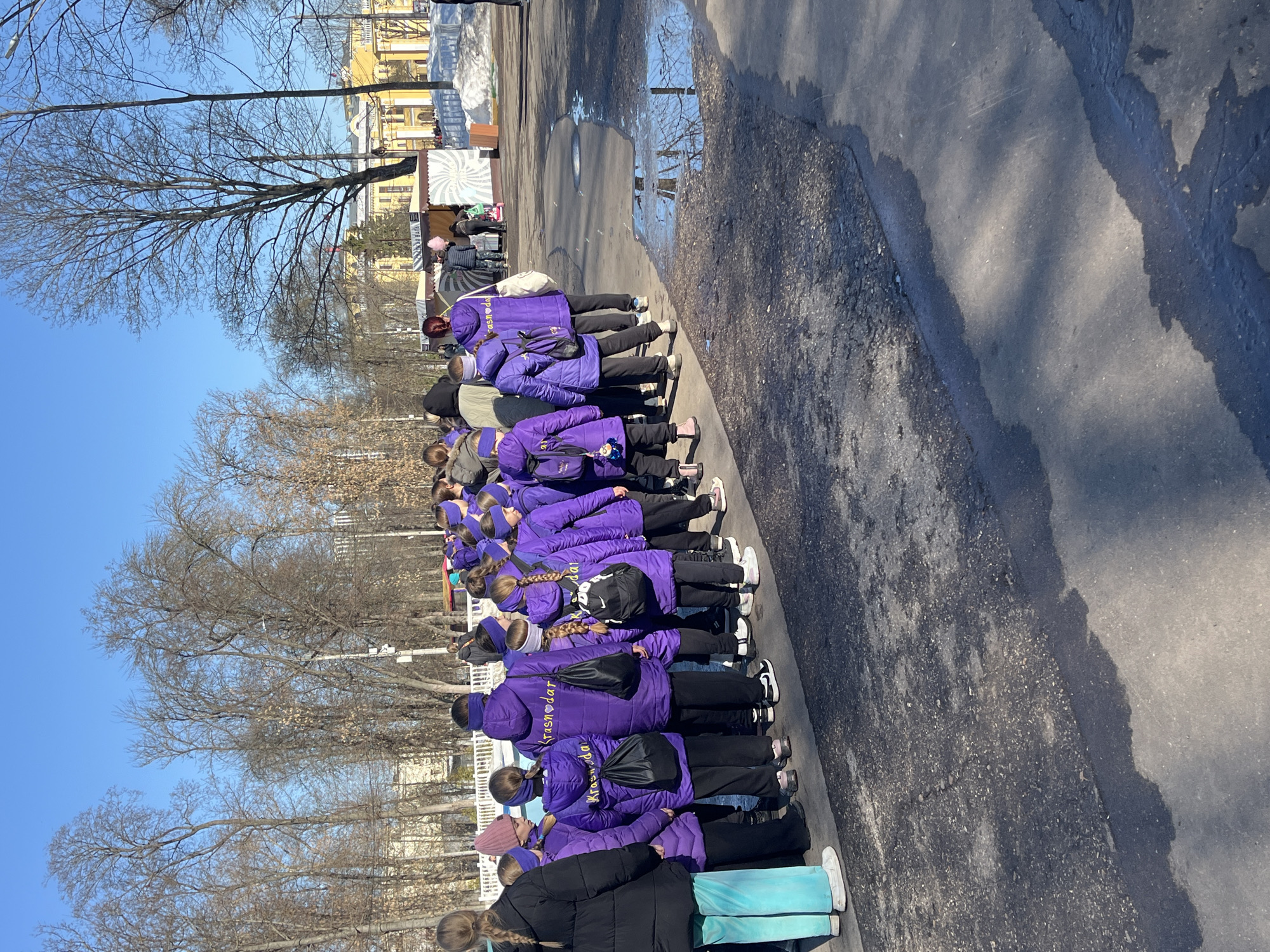 Schoolchildren in purple jackets line up on Nizhny Novgorod street