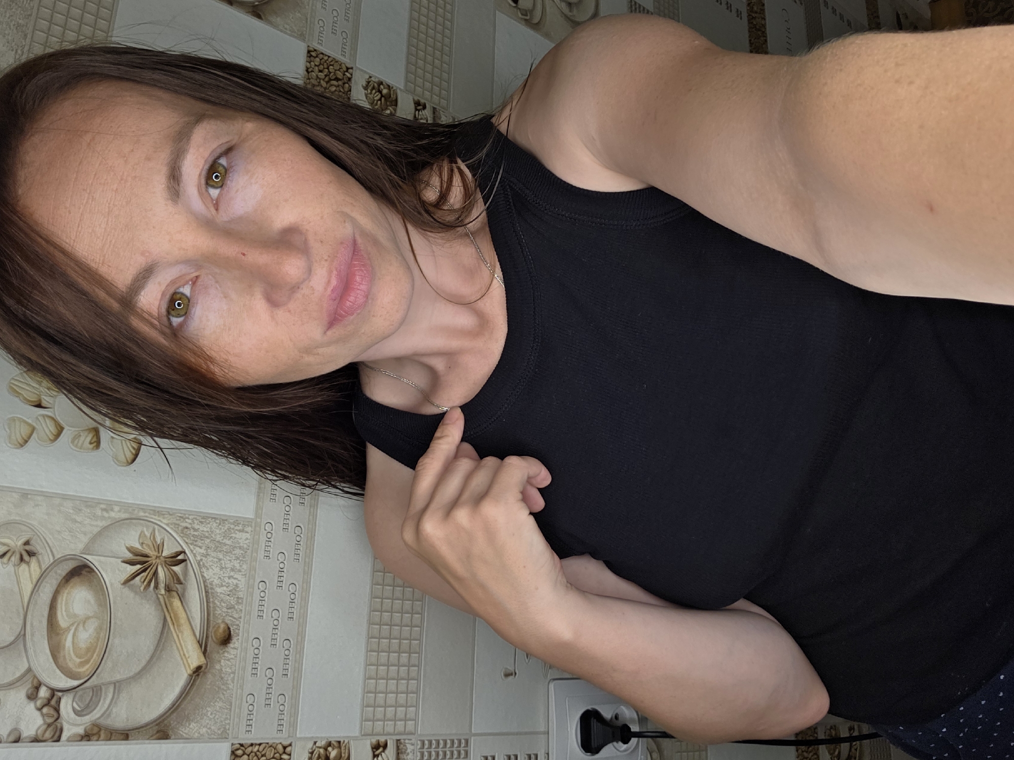 Woman documents evening routine in Chaikovsky kitchen, parking lot