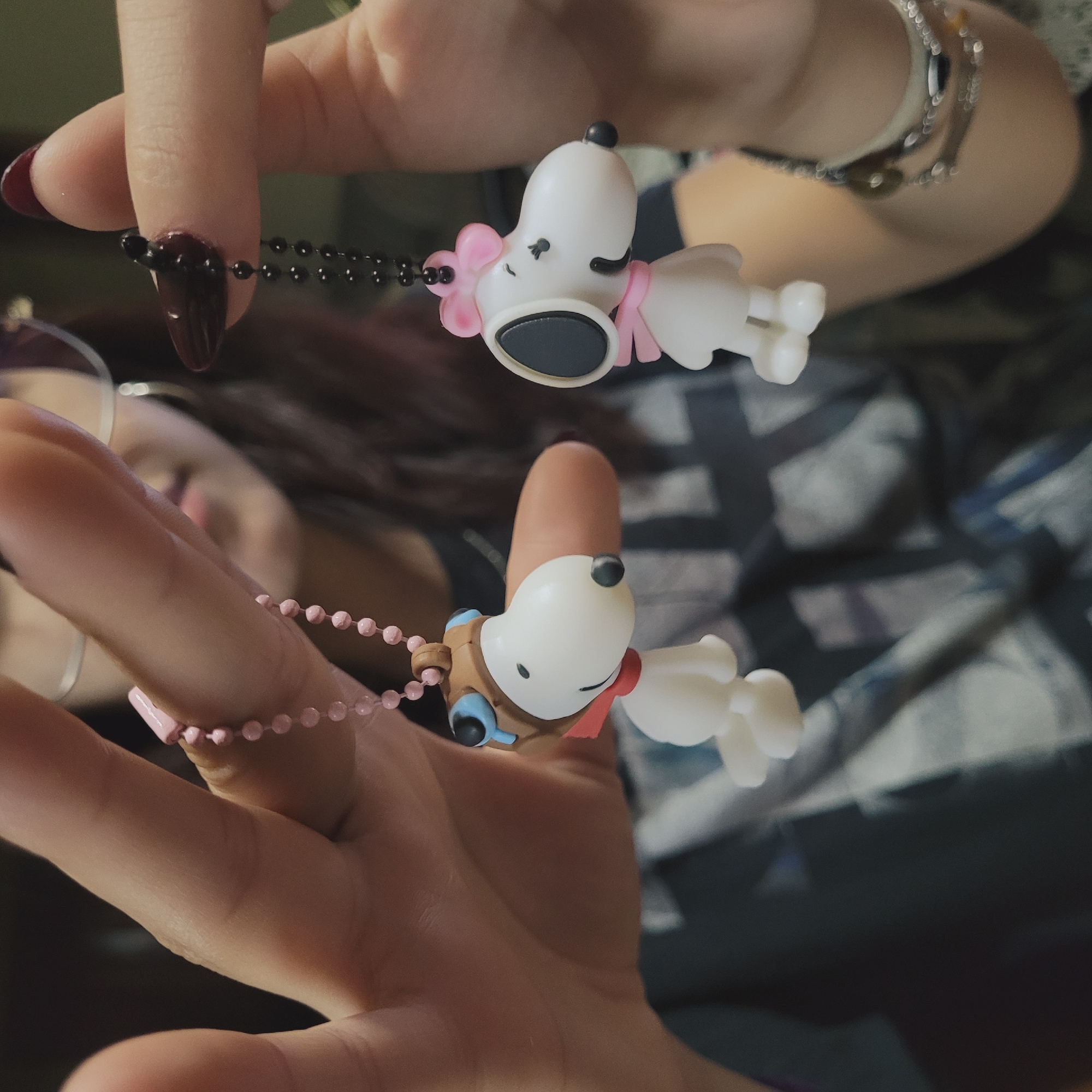 Person displays cartoon dog keychains in Catamarca, Argentina