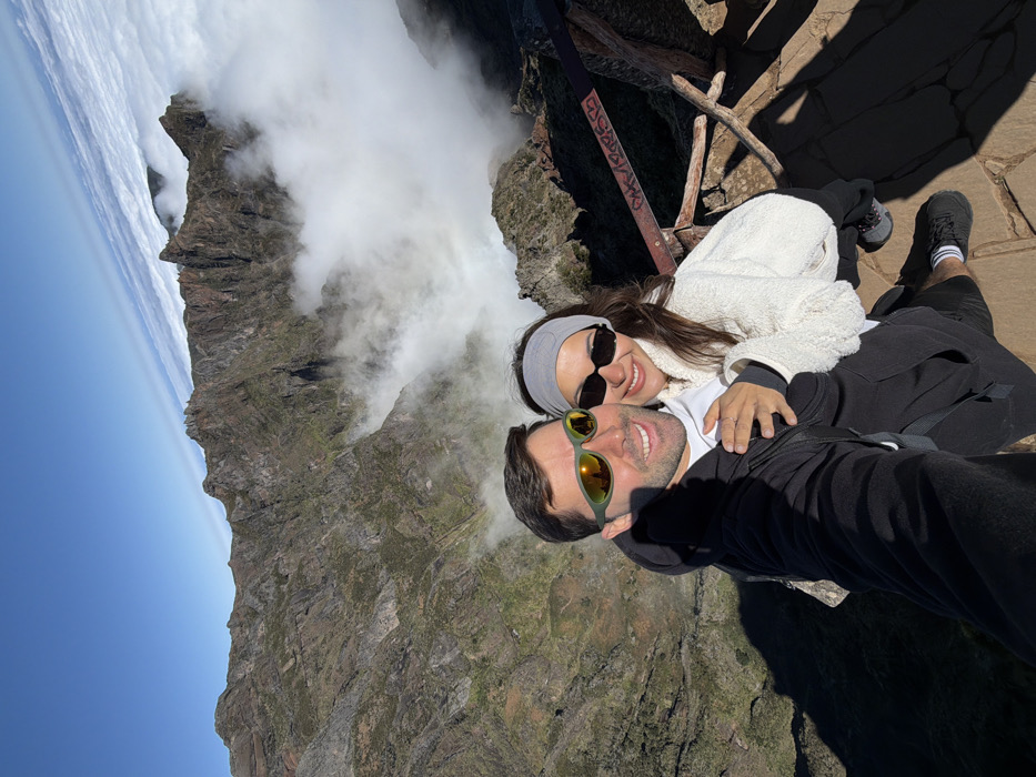 Tourists explore Madeira's mountain peaks above cloud layer