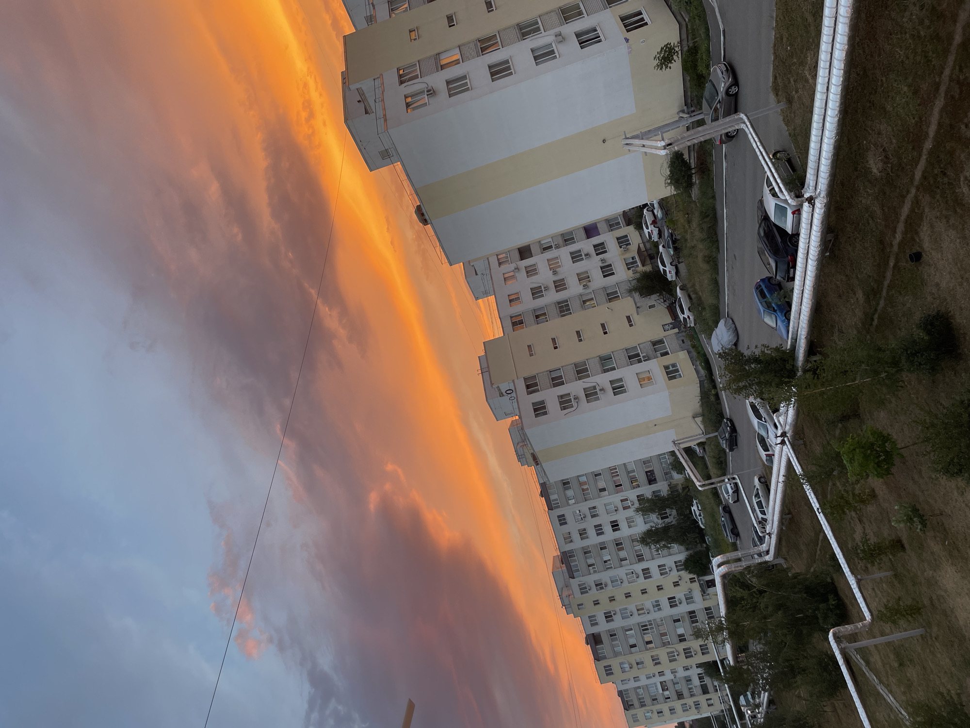Vivid summer sunset over Saratov apartment blocks