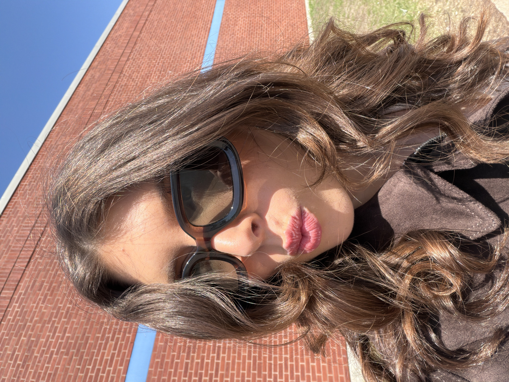 Woman in sunglasses photographed in Longueuil, Canada