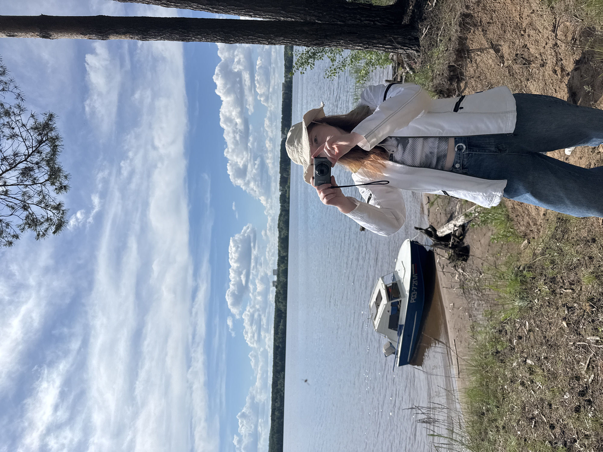 Woman documents nature outing along Kama River near Chaikovsky