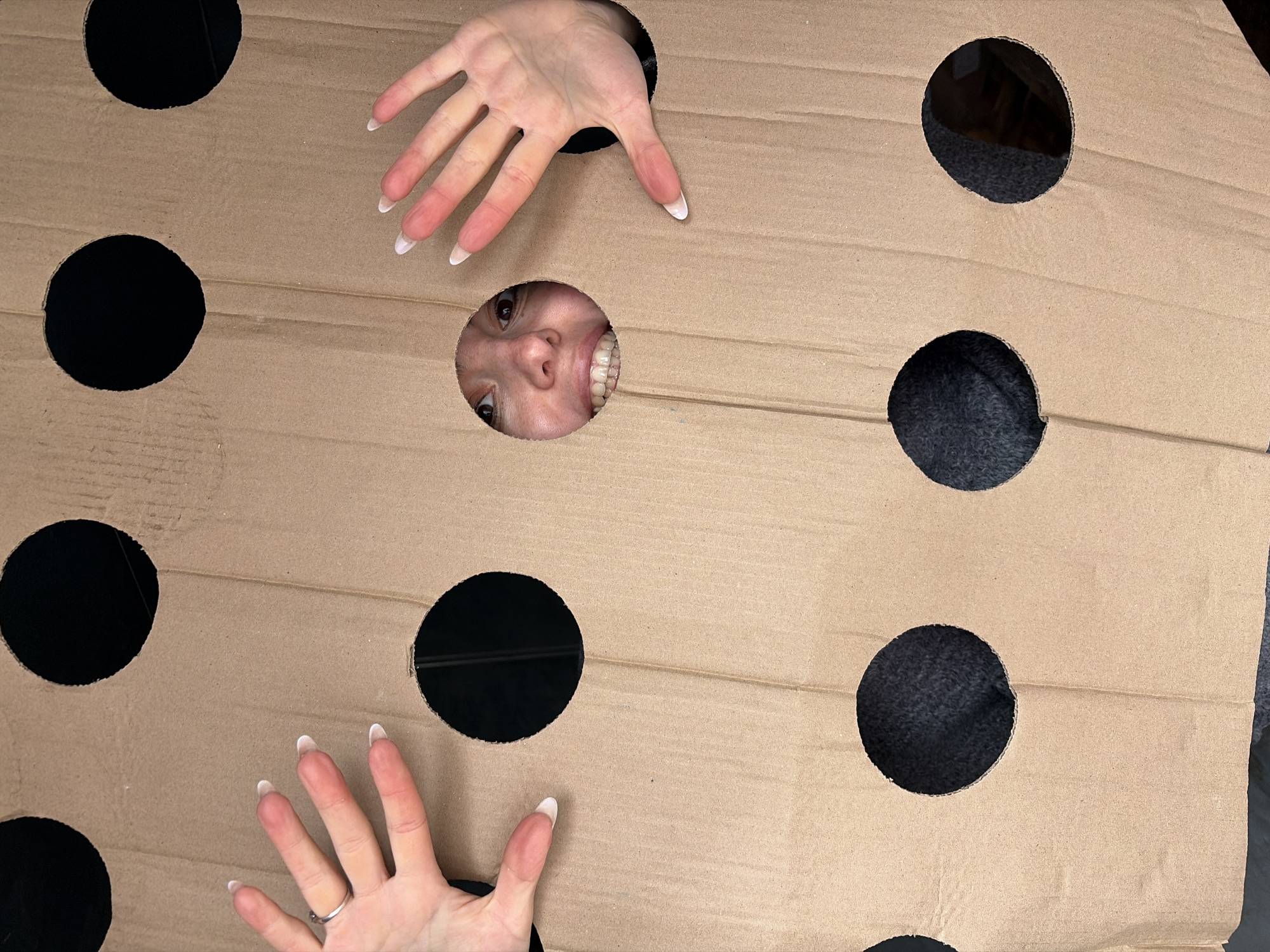 Woman plays with cardboard cutout in Izhevsk