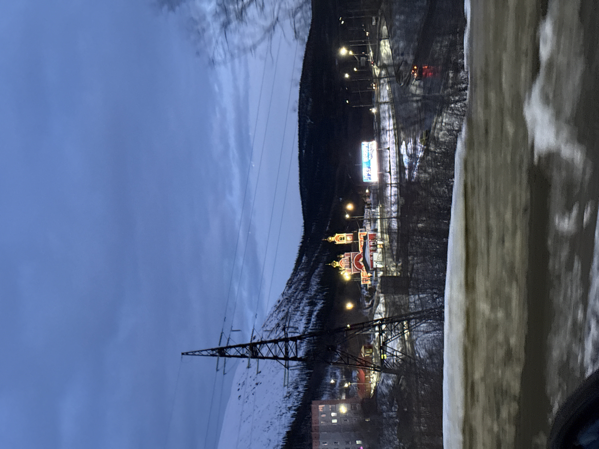 Evening transmission tower view captured in snowy Kirovsk