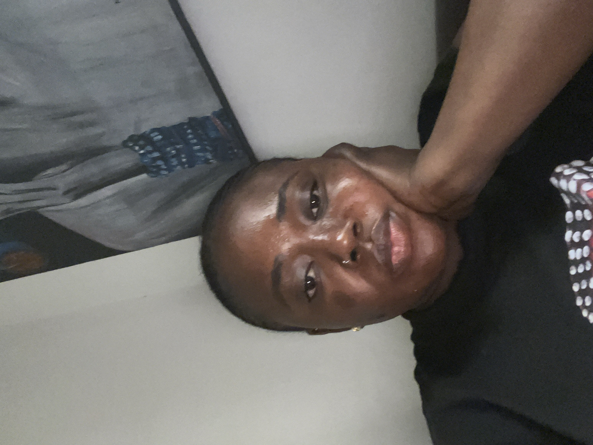 Woman documents selfie session during rainy afternoon in Abuja