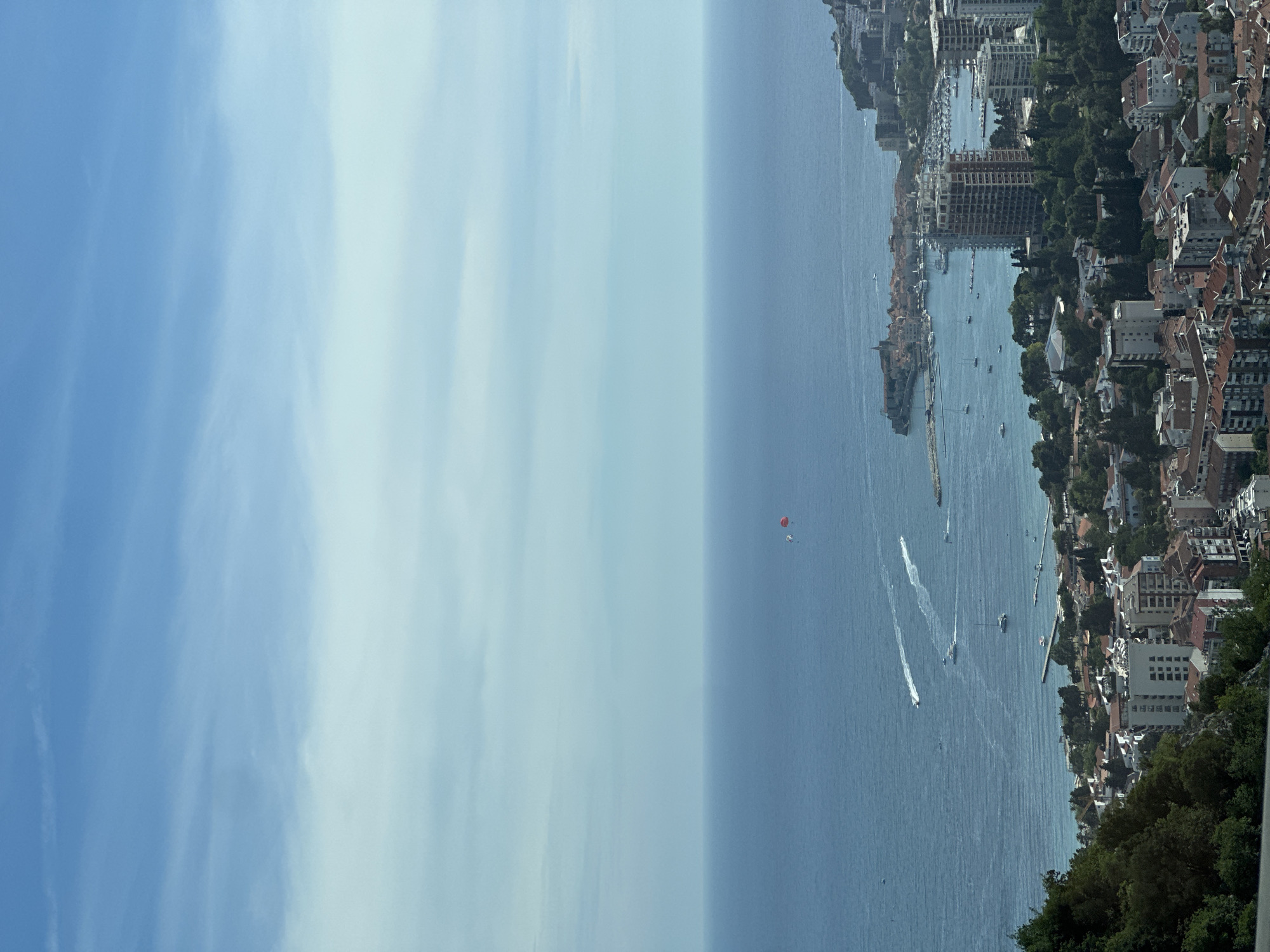 Coastal road trip through Vrela with paragliders above the Adriatic