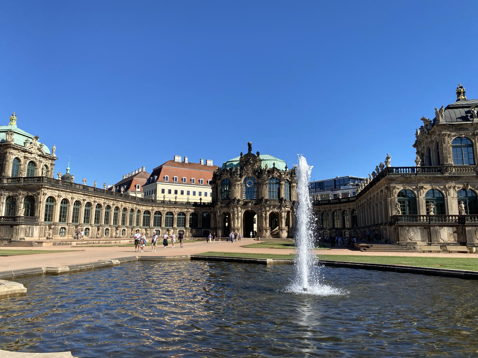 Dresden baroque landmarks documented by visitors on sunny afternoon