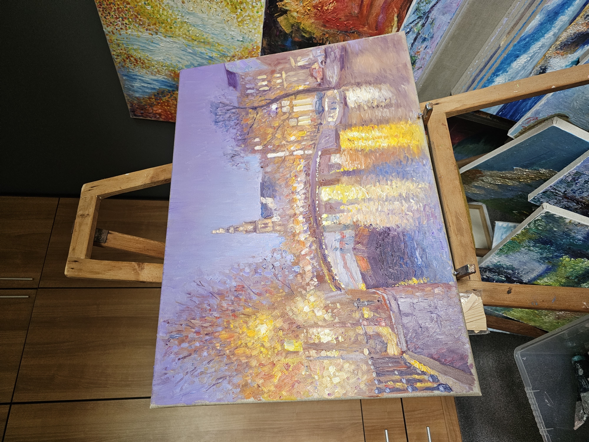 Post-impressionist painting captures nighttime Plovdiv cityscape with warm lighting