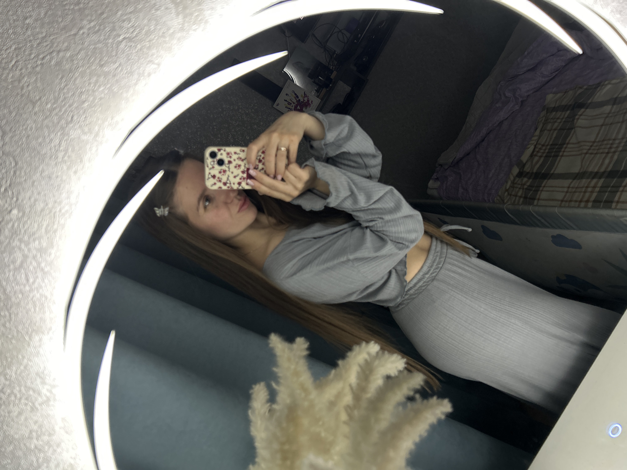 Woman takes mirror selfies in Klin apartment