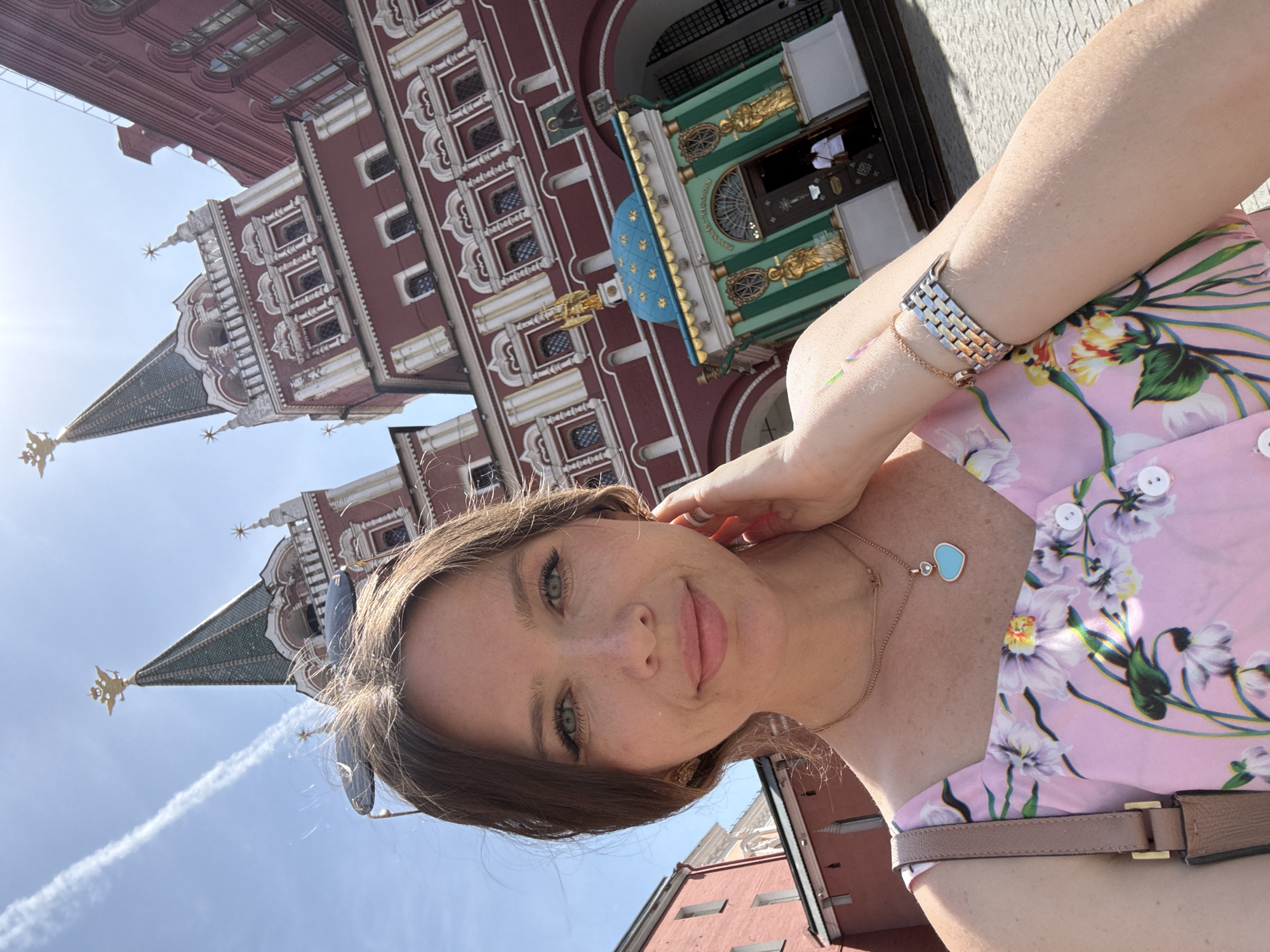 Tourist photographs herself at Moscow's Red Square landmarks