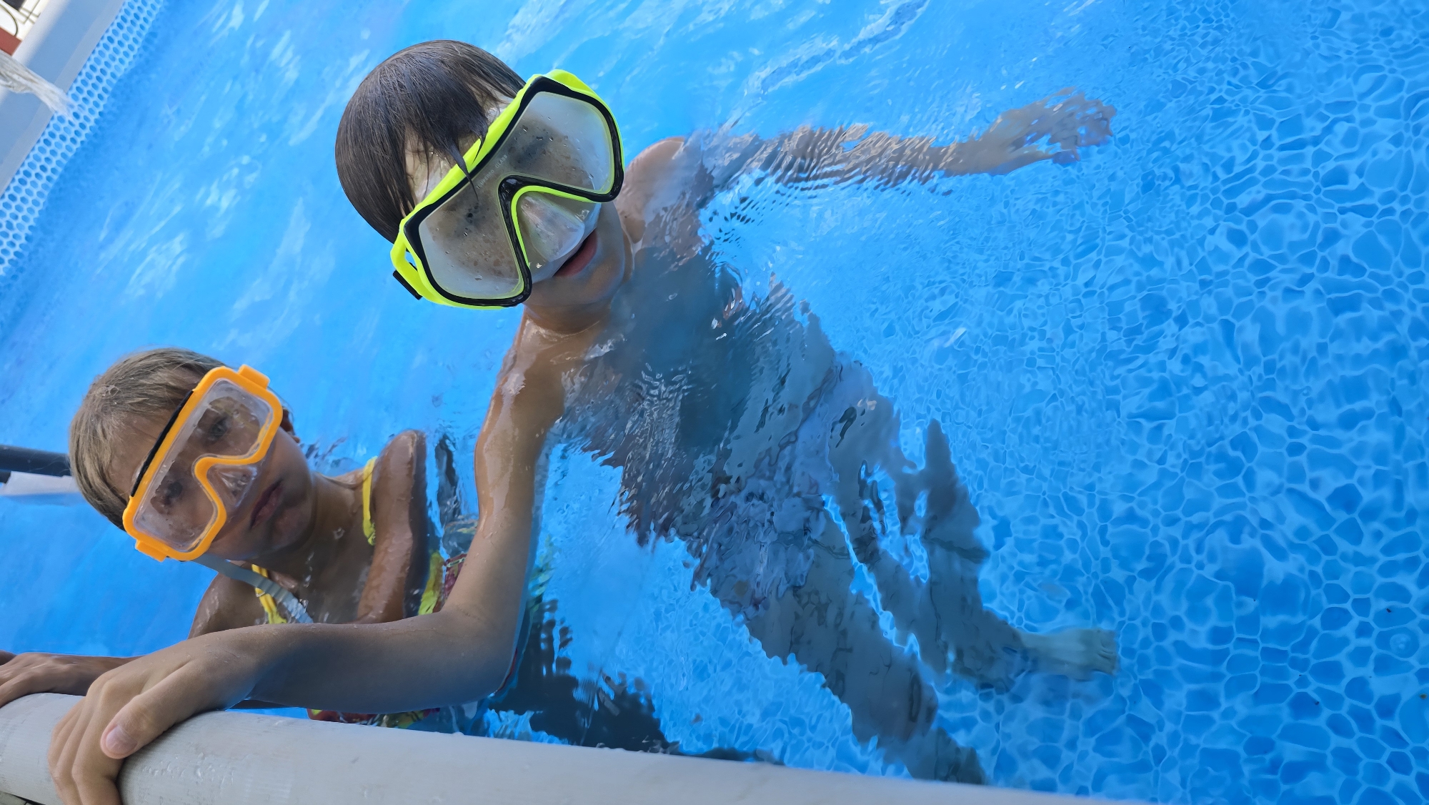 Pool day in Tiraspol: kids, a rope swing, and a friendly Lab
