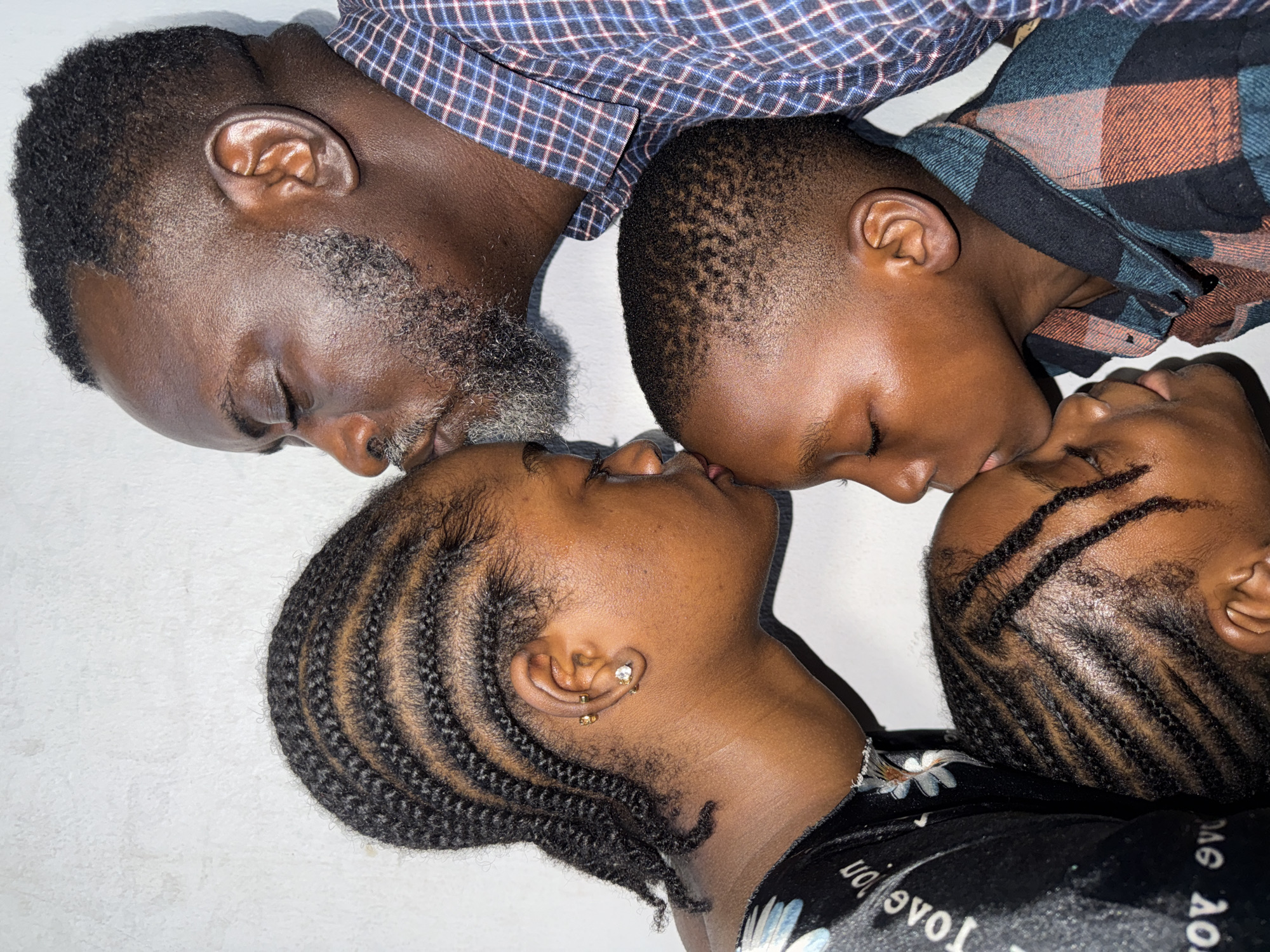 Sunday family portraits and quiet affection in Ado, Nigeria