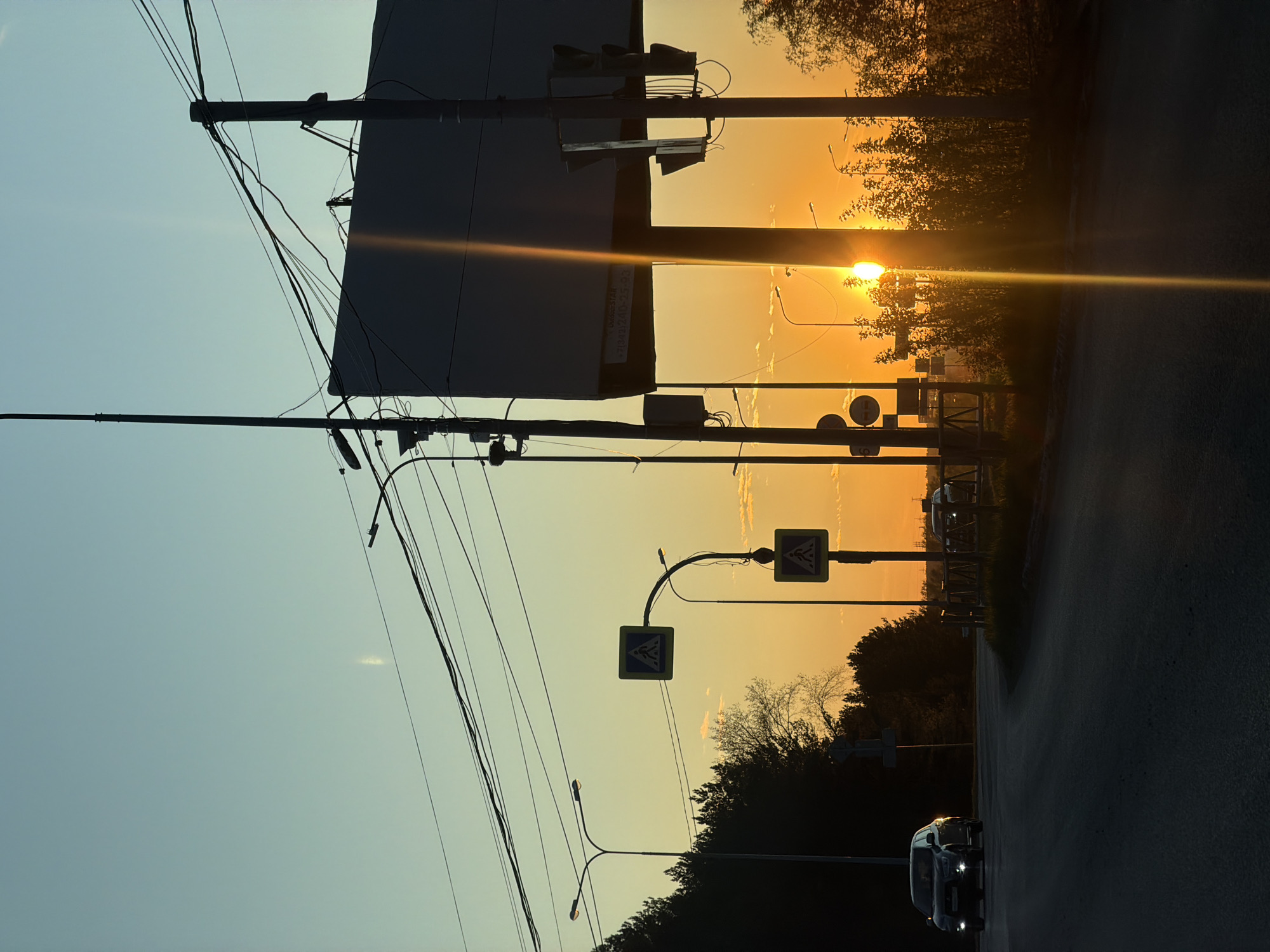 Sunset observed in Chaikovsky, Russia with silhouetted infrastructure