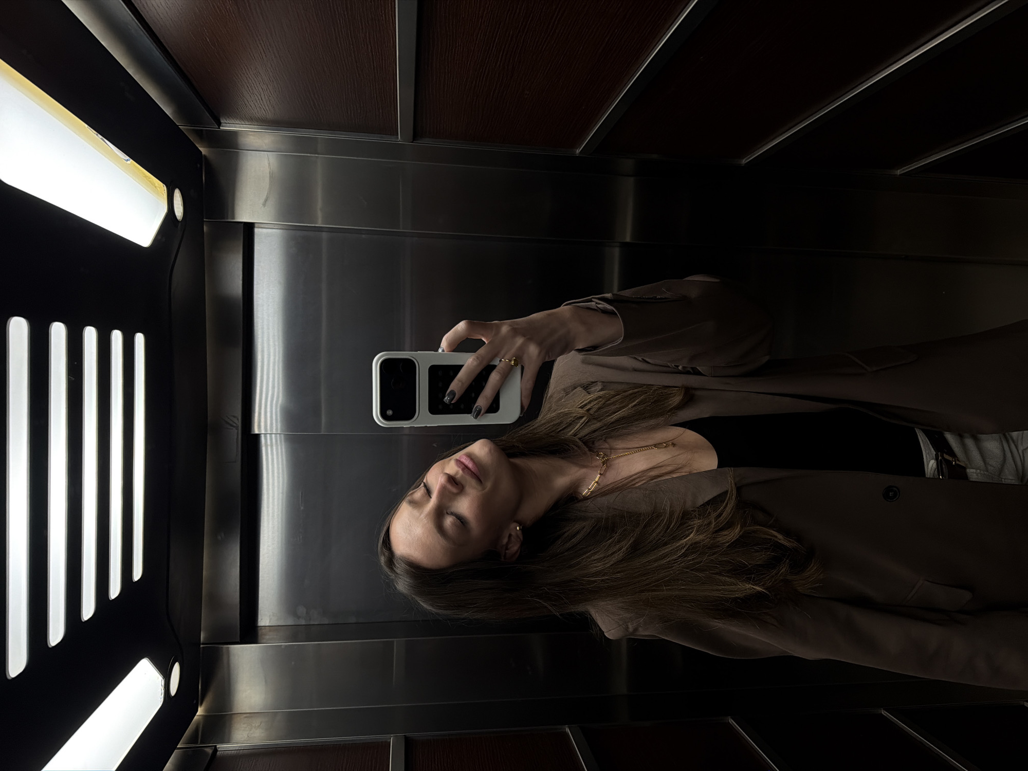 Woman takes elevator selfie in Budva, Montenegro