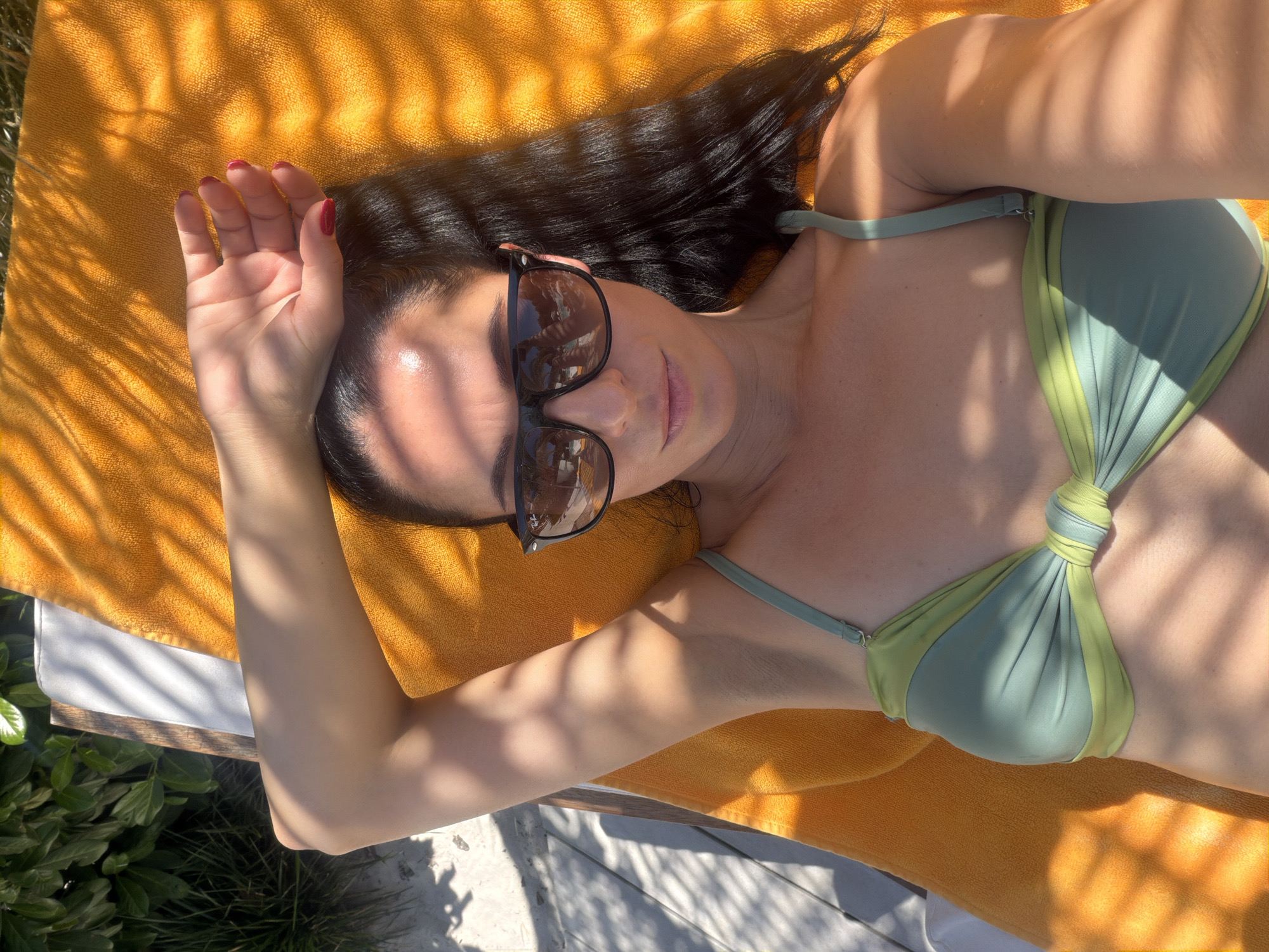 Lounging in the sun on an orange towel, Pleven