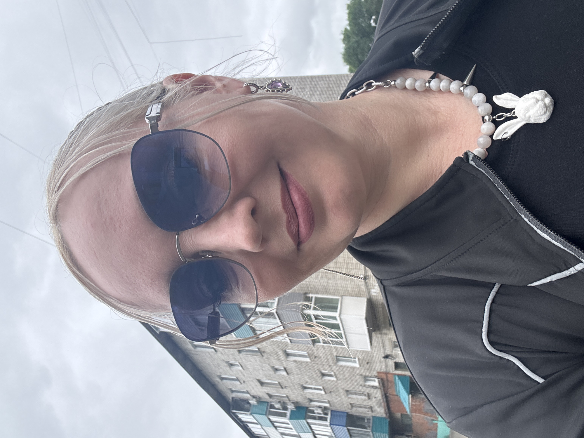 Selfie moment outside a brick apartment block in Komsomolsk-on-Amur
