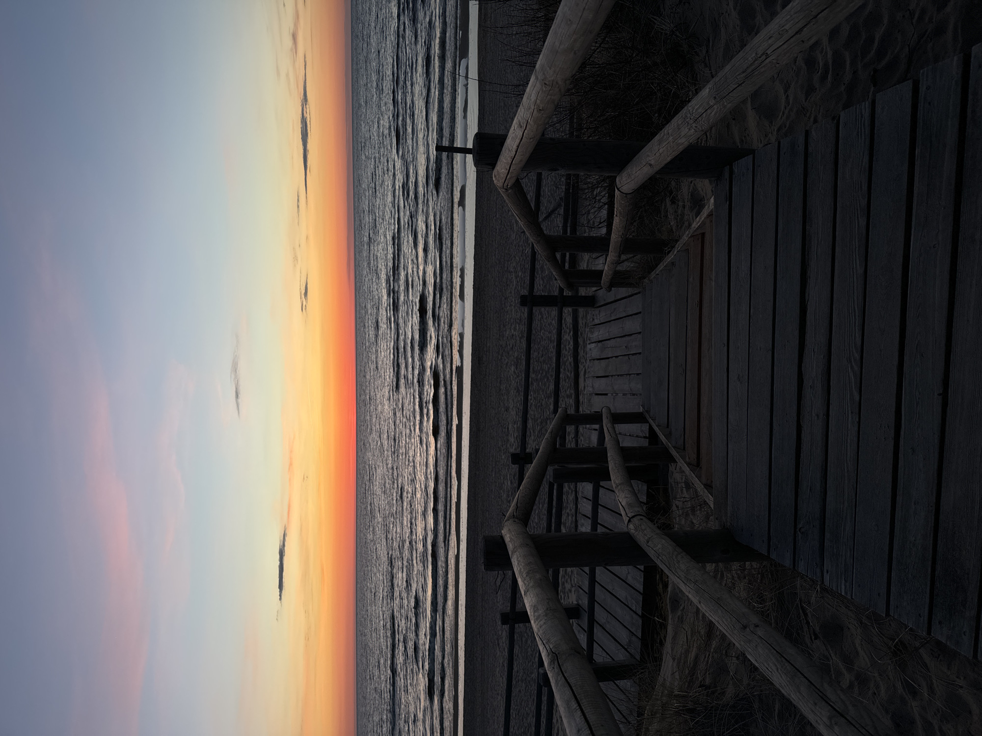 Sunset observed at Garciems beach, Latvia with wooden stairs