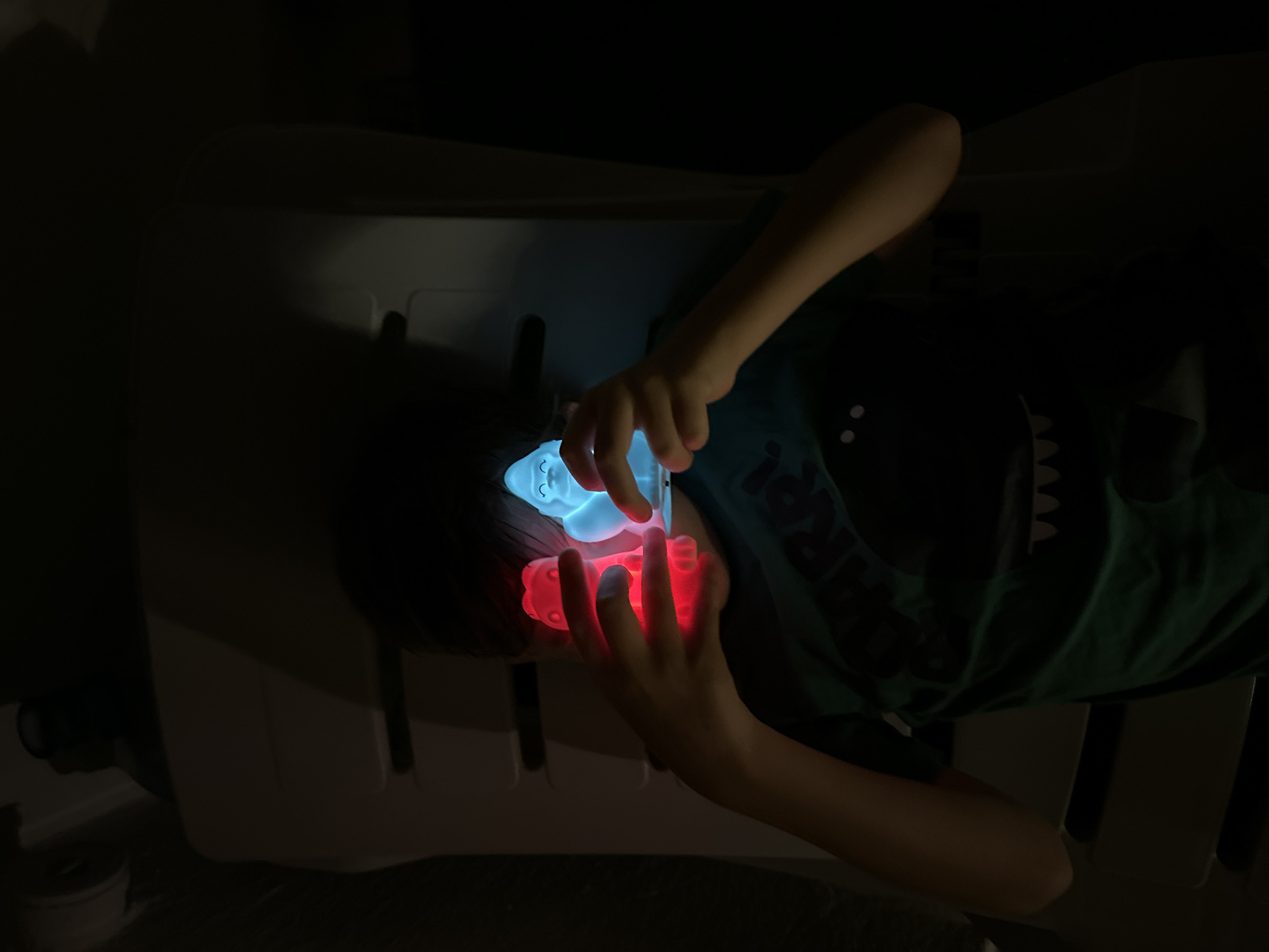 Glowing toys and downtime in a dim Fethiye room
