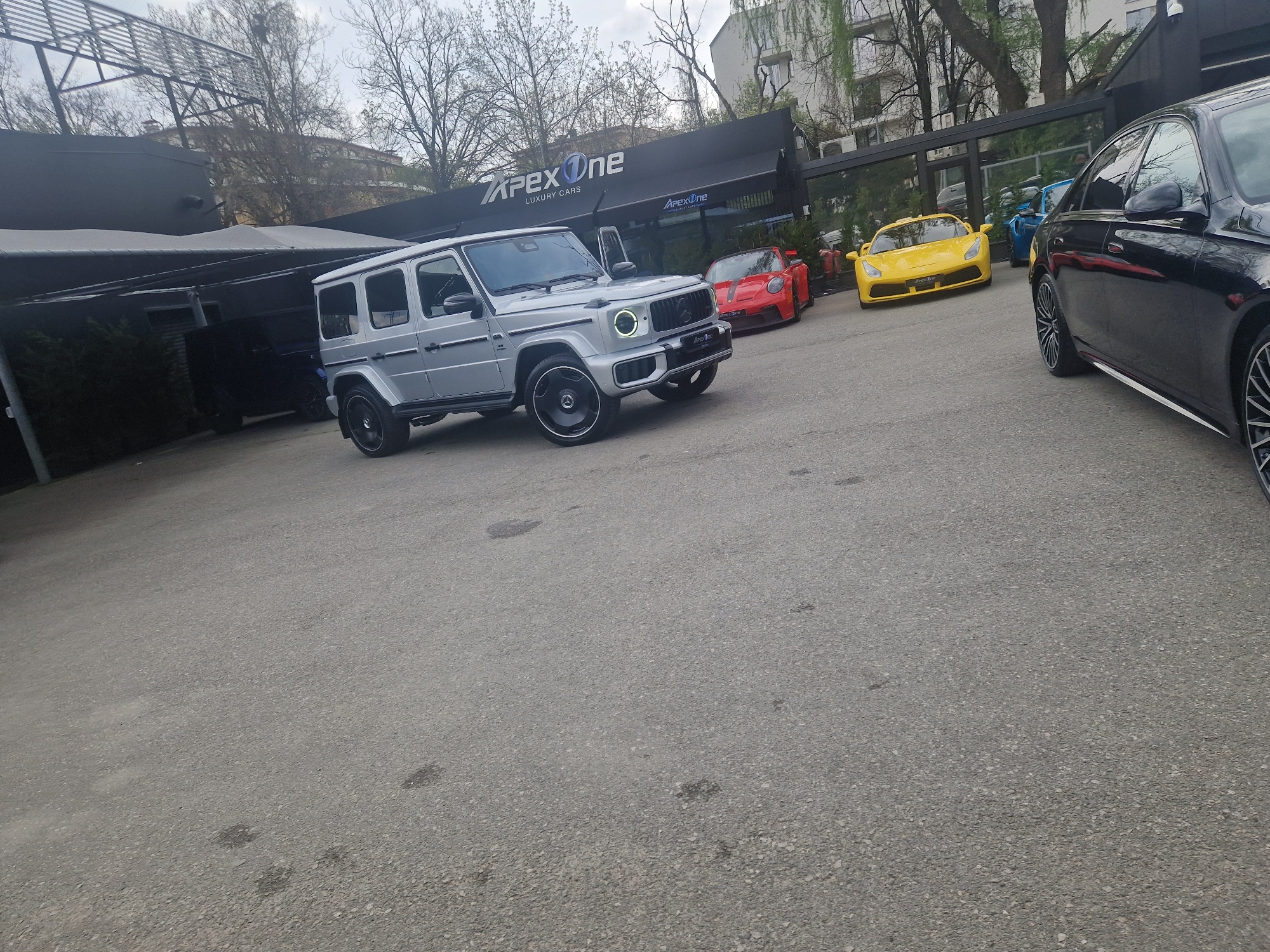 Overcast day captured at APEX One luxury car dealership