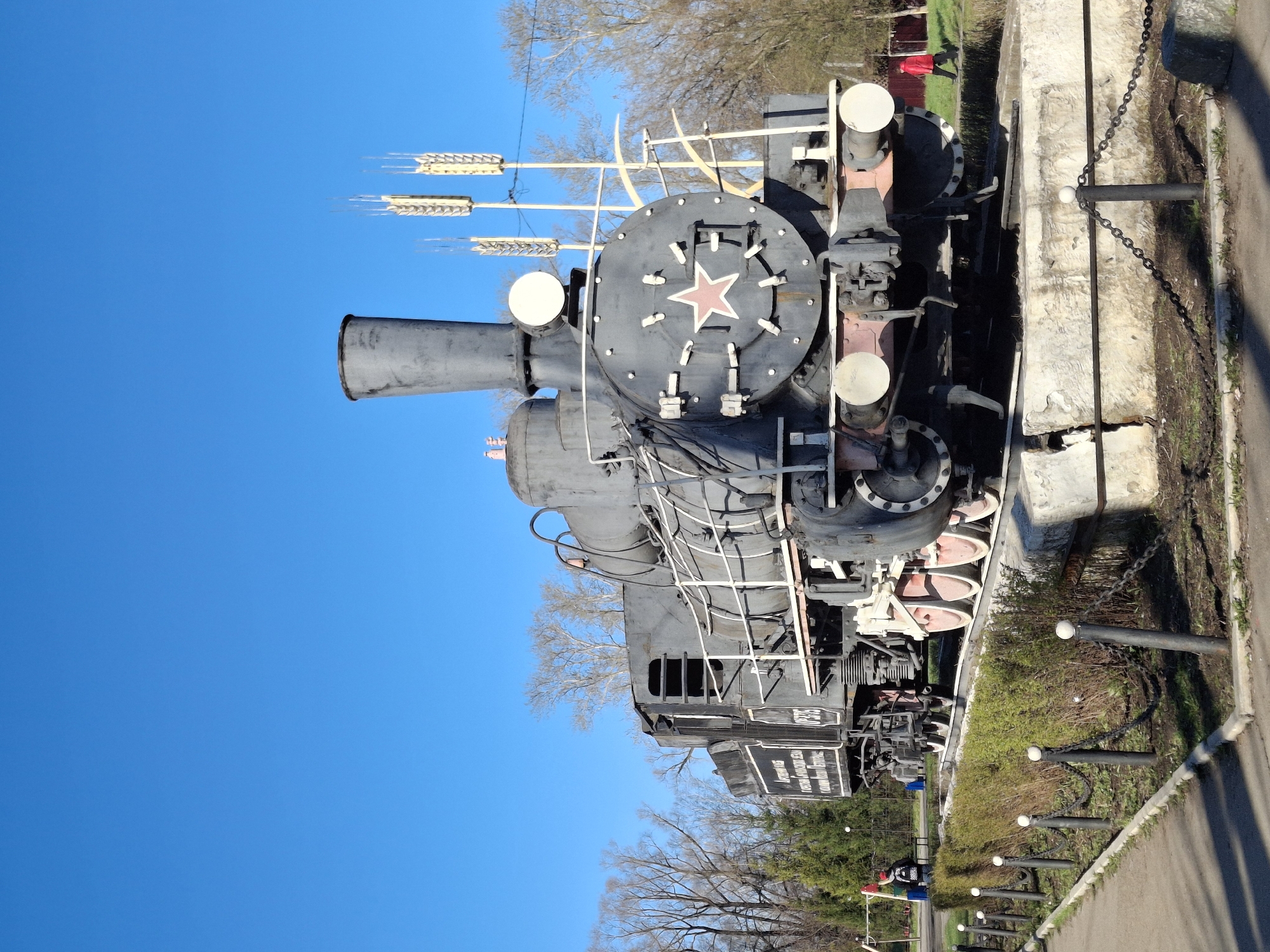 Woman visits historic locomotive monument in Sarapul, Russia
