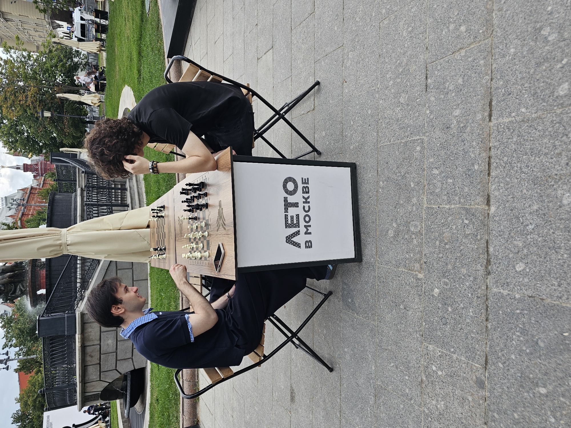 Casual outdoor chess game in Moscow on a summer afternoon