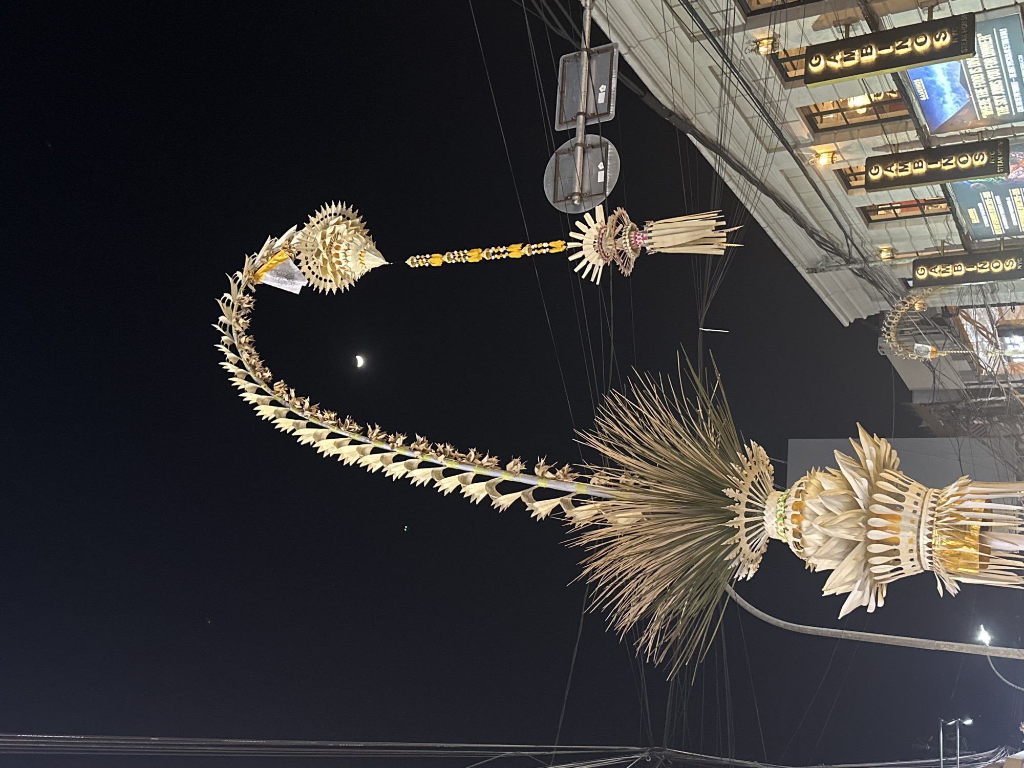Kuta nightlife: street food, traditional performance, and neon signs