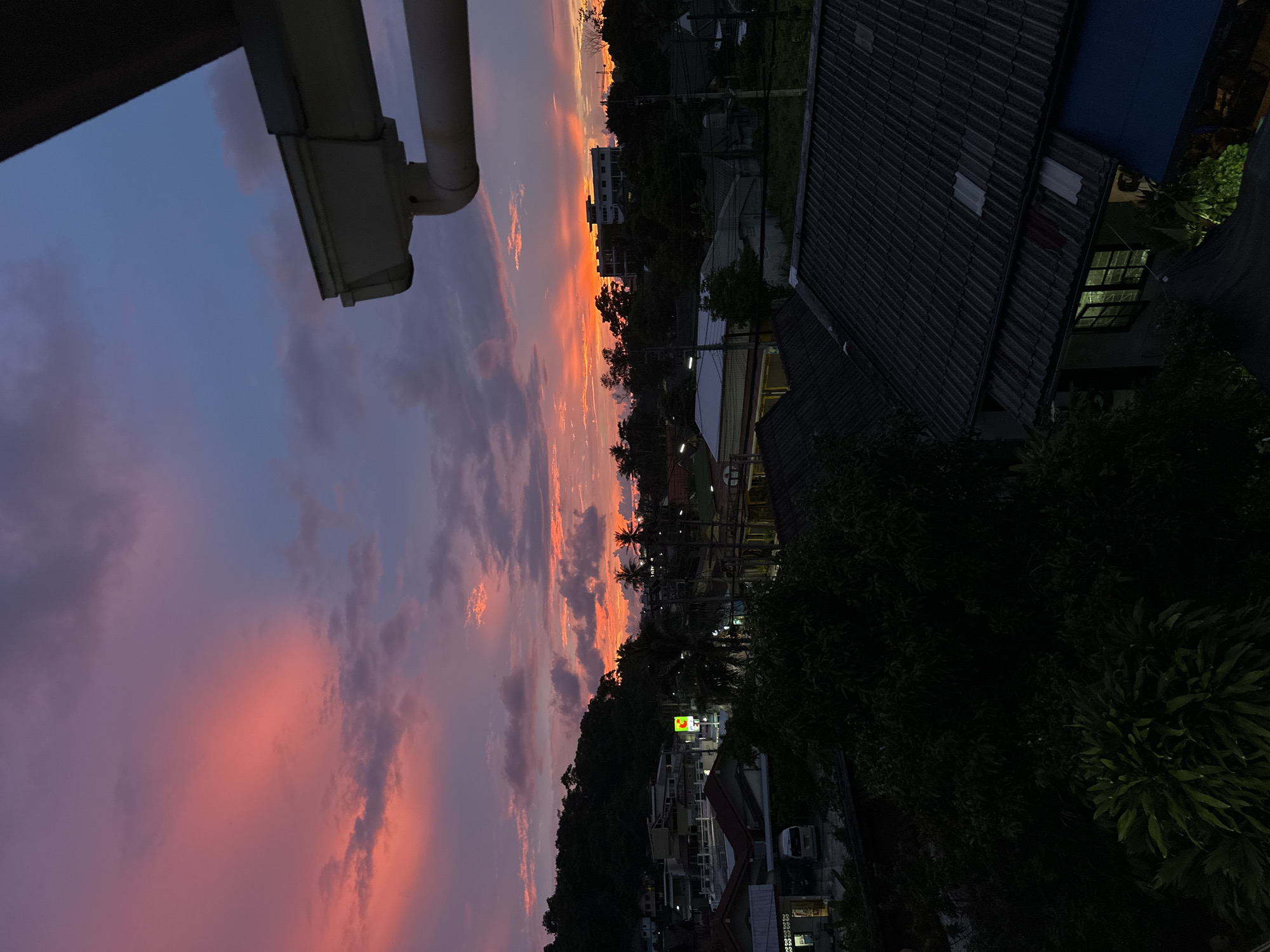 Karon sunset watched from a rooftop, one odd lighter shot