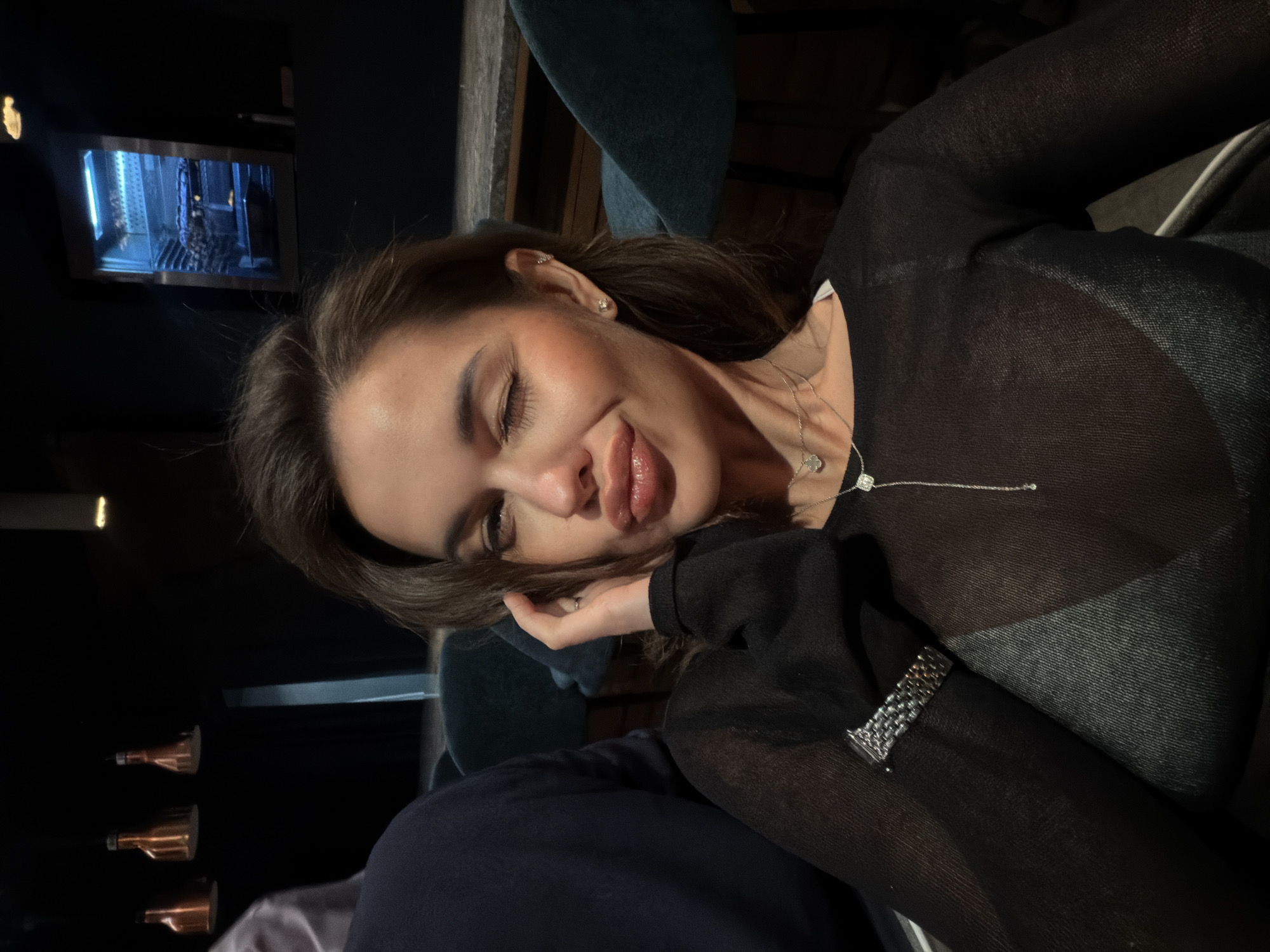 Woman photographed during quiet evening at Krasnoyarsk restaurant