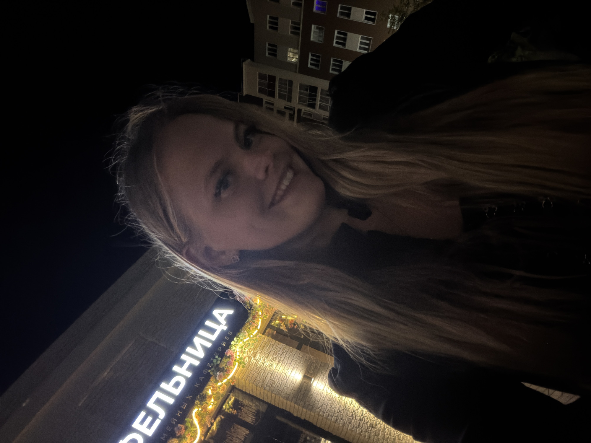 Nighttime moments outside a building in Pervomaysky, Russia